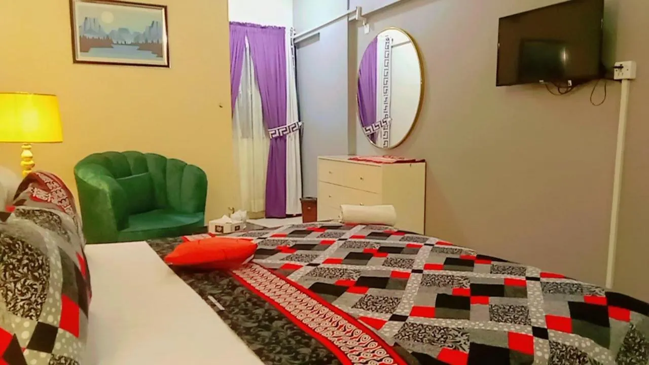 Communal lounge/ TV room, Bed in Hotel 7 DHA