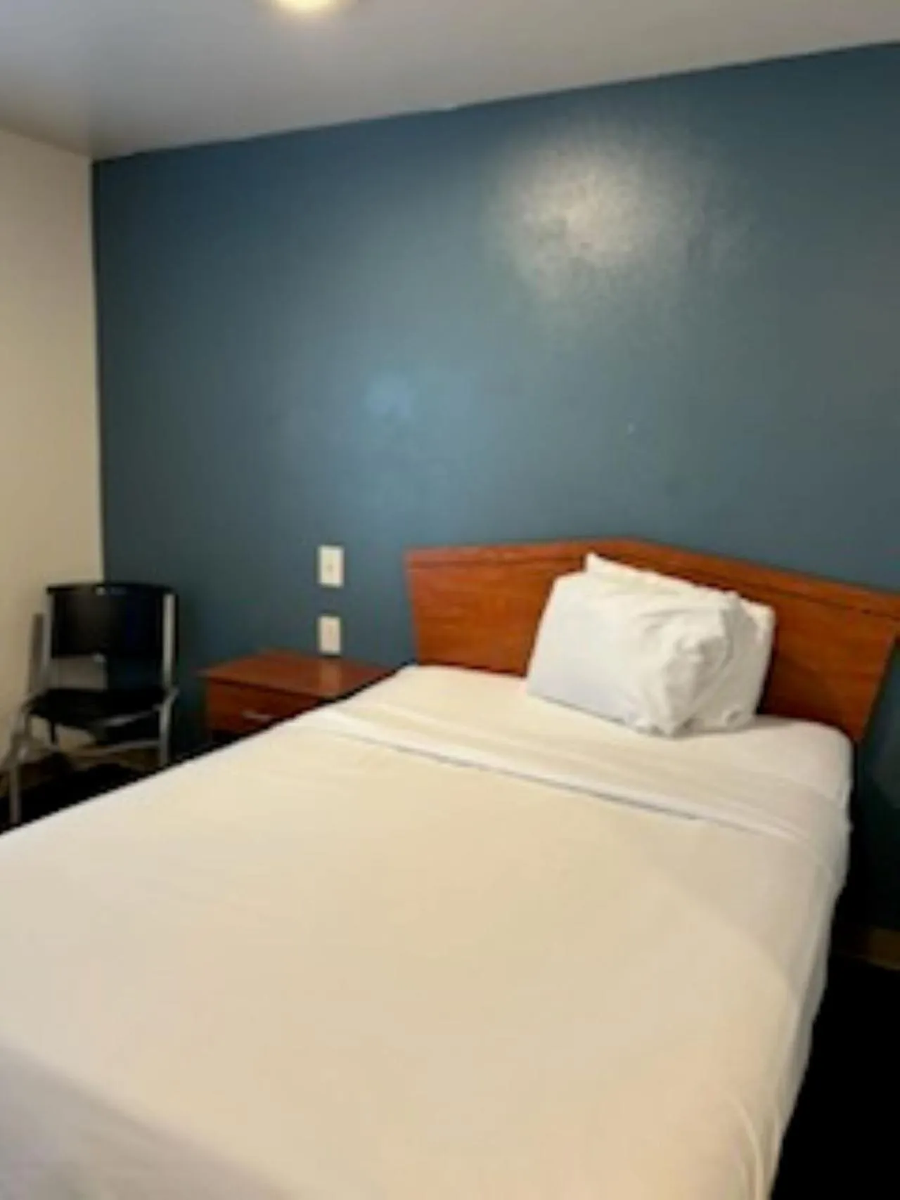 Bedroom, Bed in WoodSpring Suites Columbus near Fort Benning