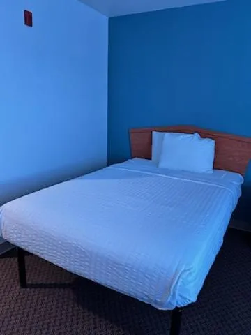 Bedroom, Bed in WoodSpring Suites Columbus near Fort Benning