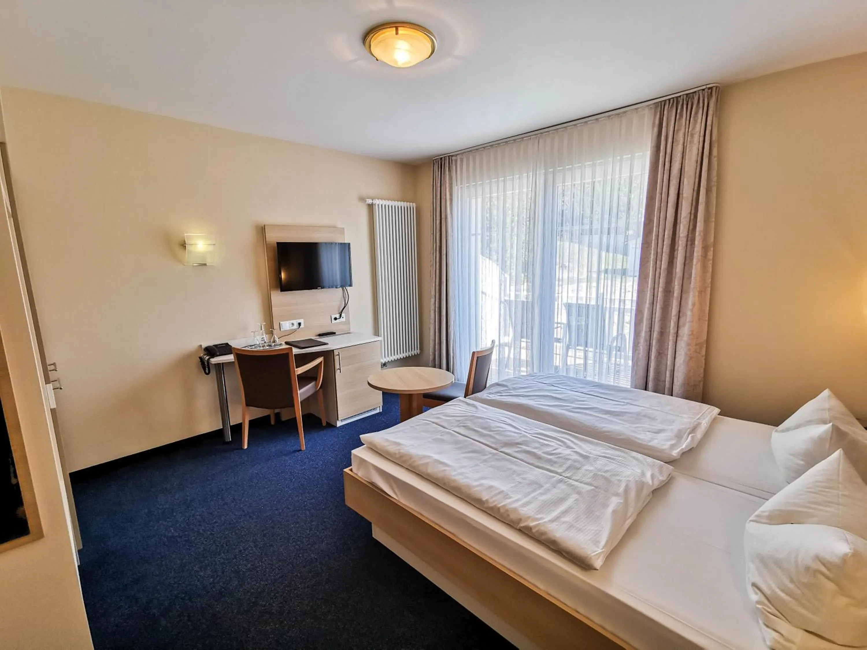 Photo of the whole room, Bed in Wald-Hotel