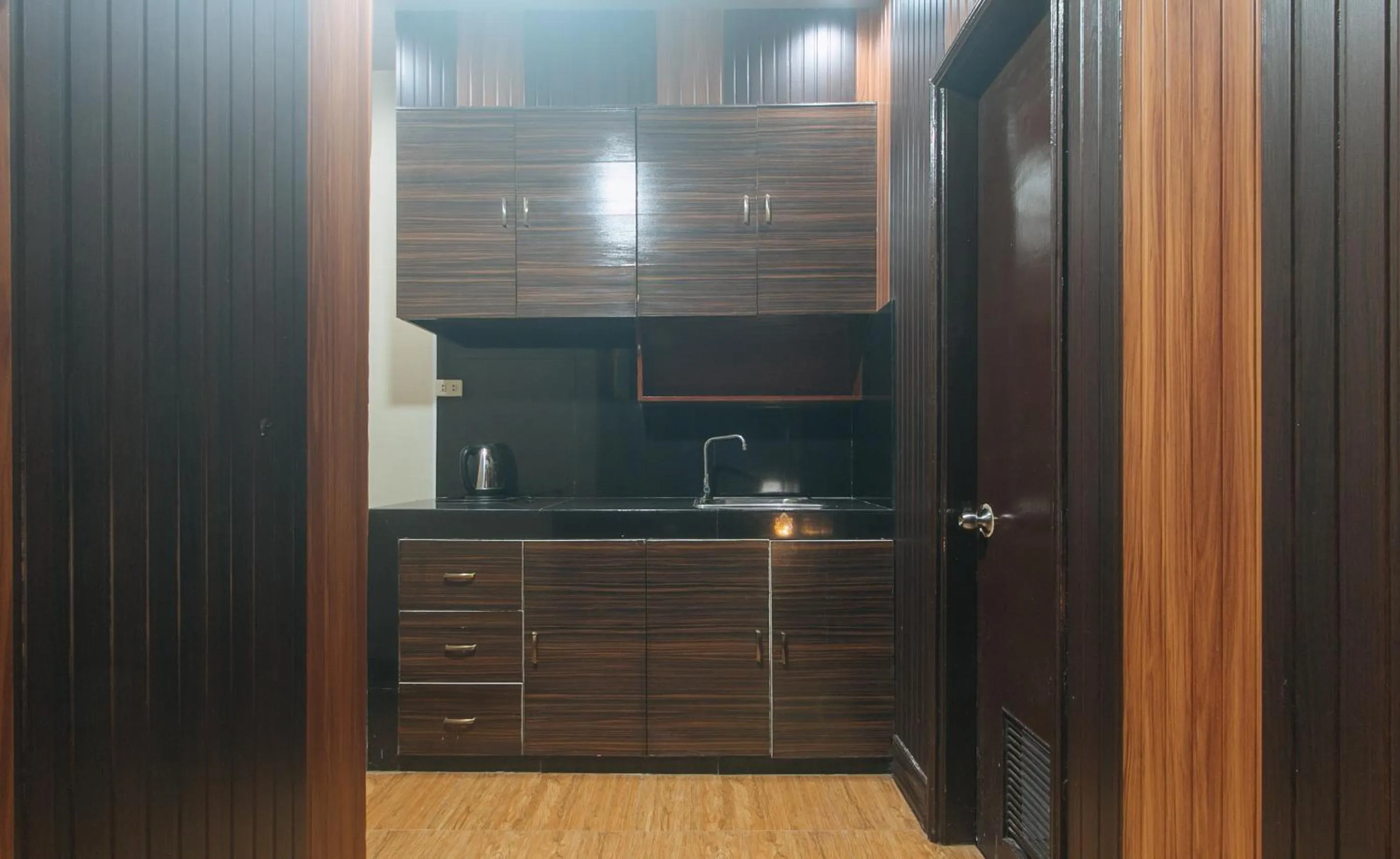 Kitchen or kitchenette in RedDoorz Plus at Canley Residential