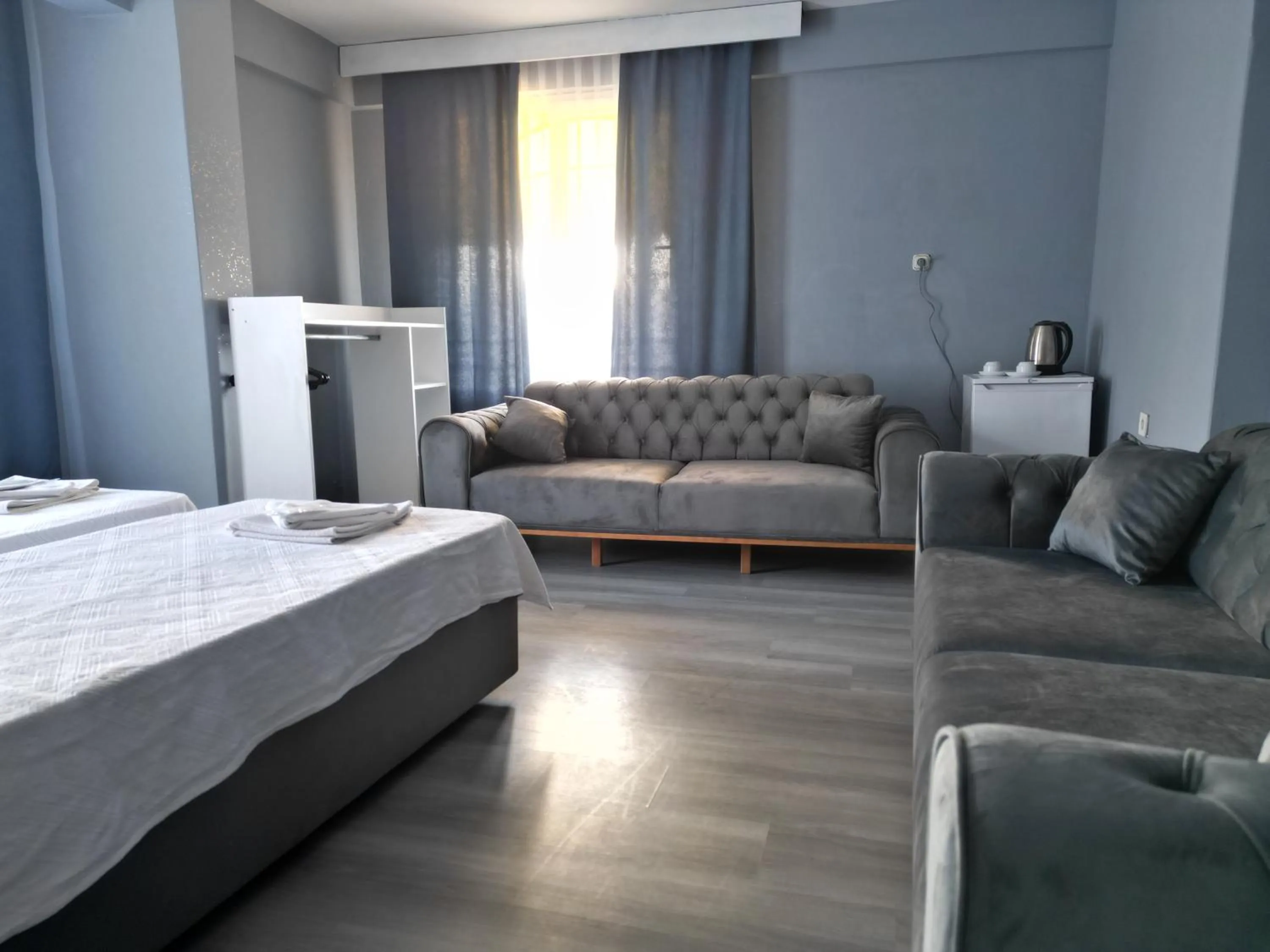 Seating area, Bed in Akman City Hotel