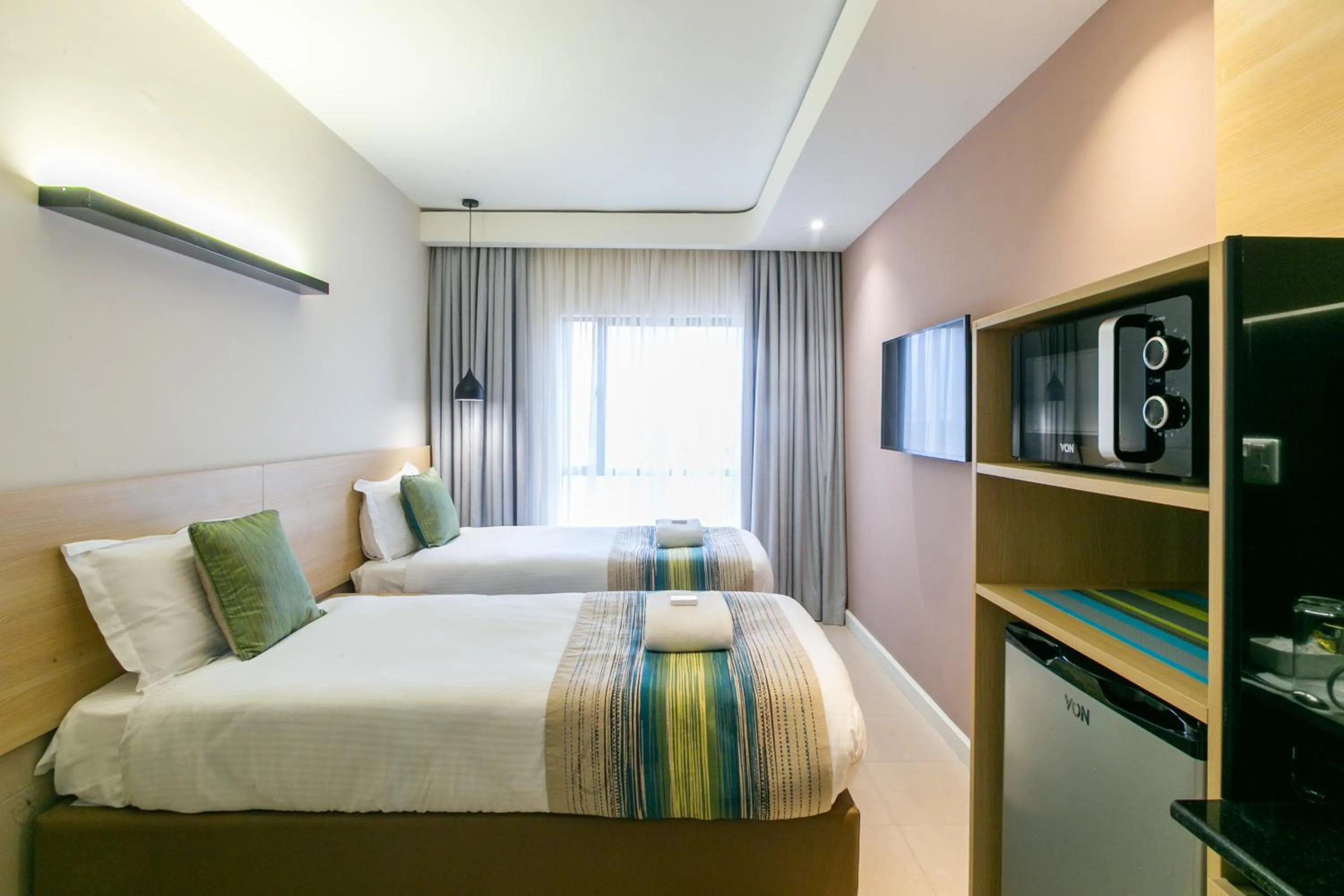 Photo of the whole room, Bed in Kozi Suites Nairobi Airport
