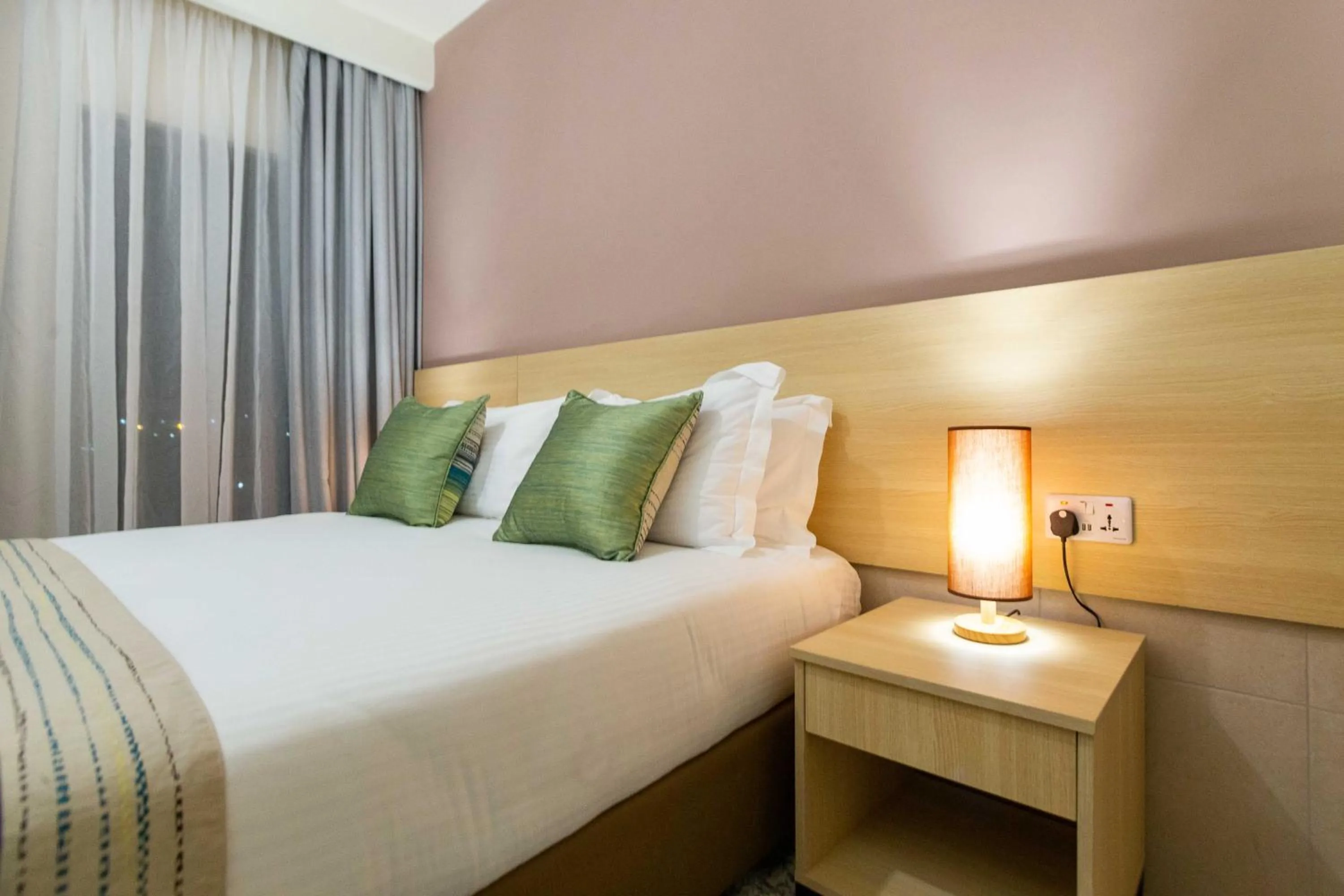 Photo of the whole room, Bed in Kozi Suites Nairobi Airport