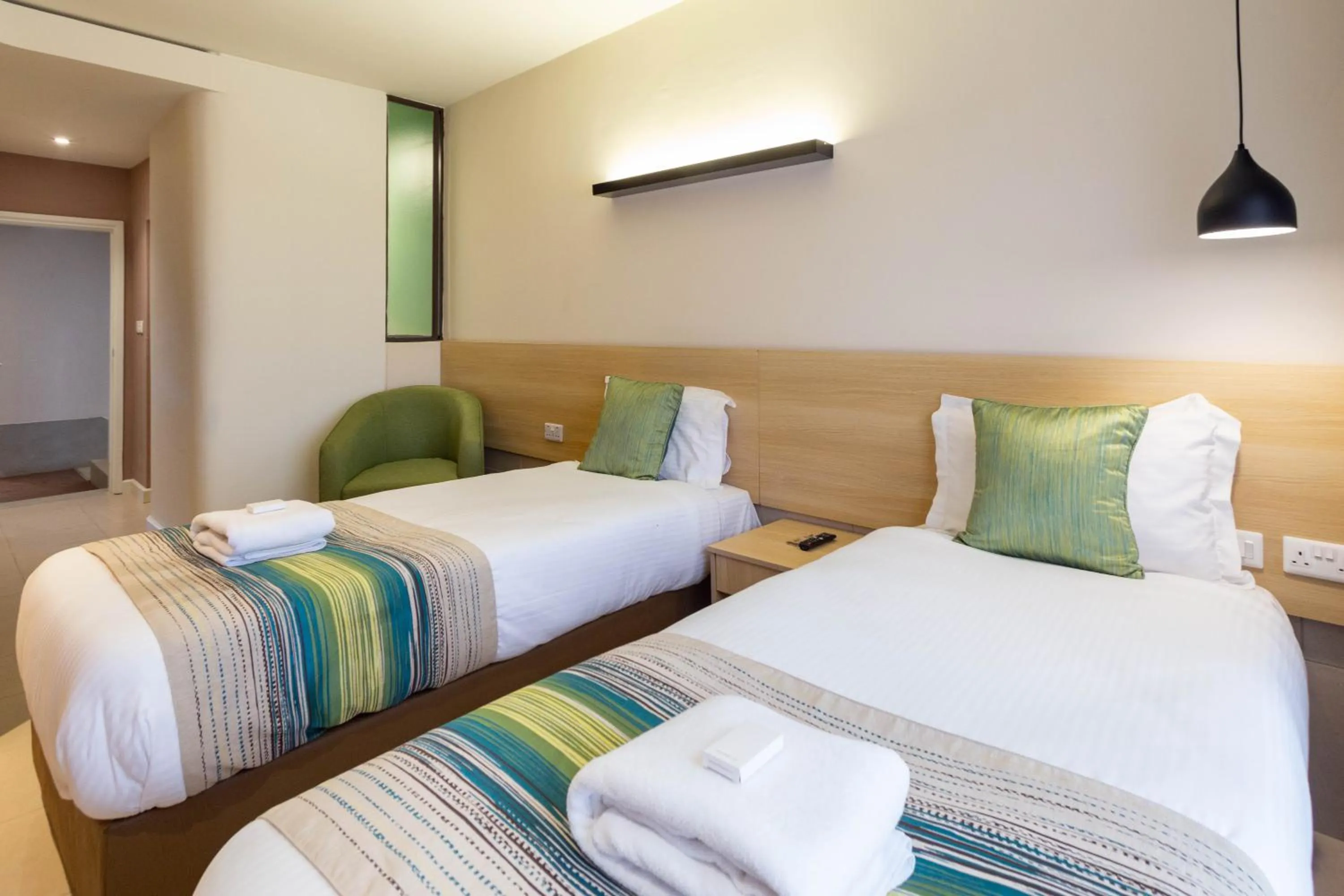 Photo of the whole room, Bed in Kozi Suites Nairobi Airport