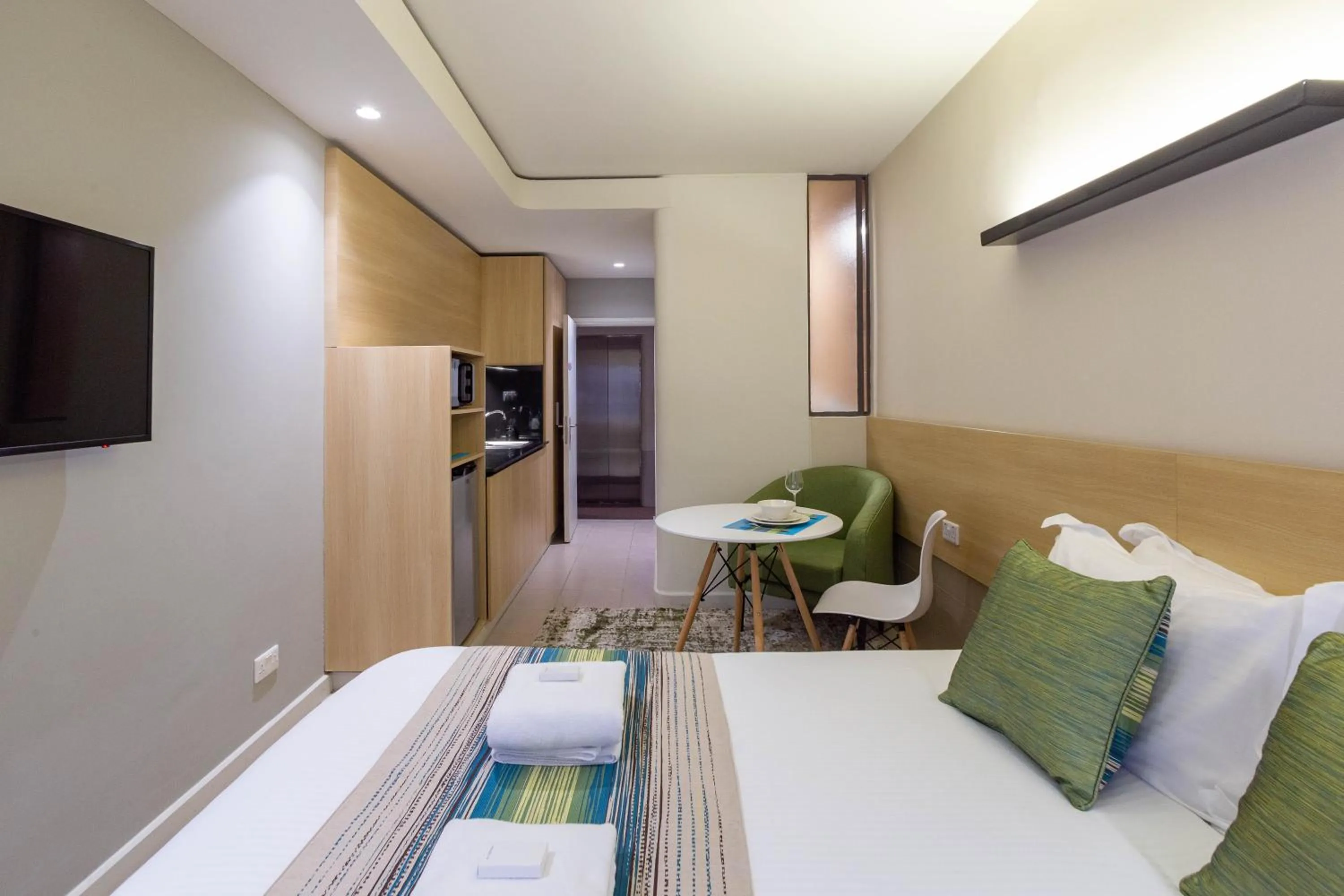 Photo of the whole room, Bed in Kozi Suites Nairobi Airport