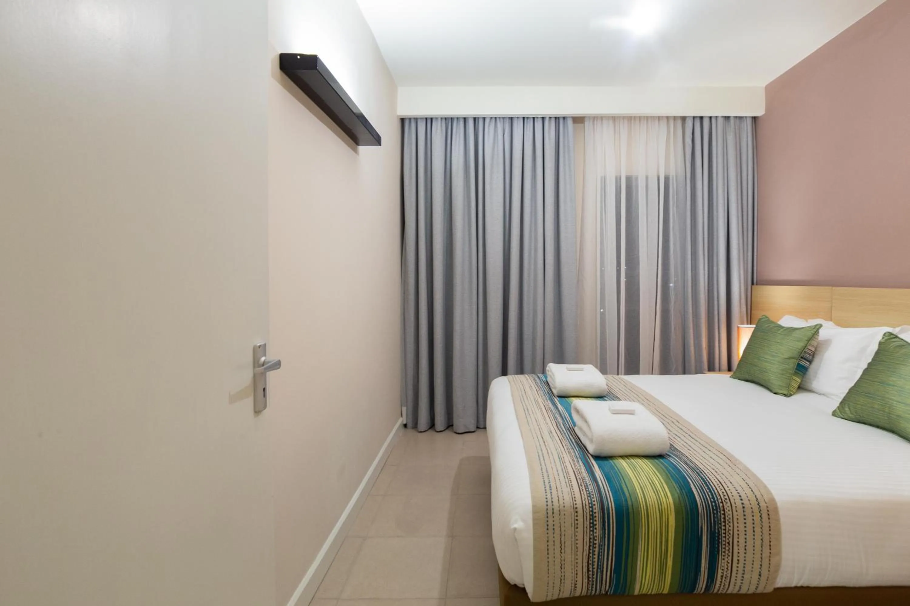 Photo of the whole room, Bed in Kozi Suites Nairobi Airport