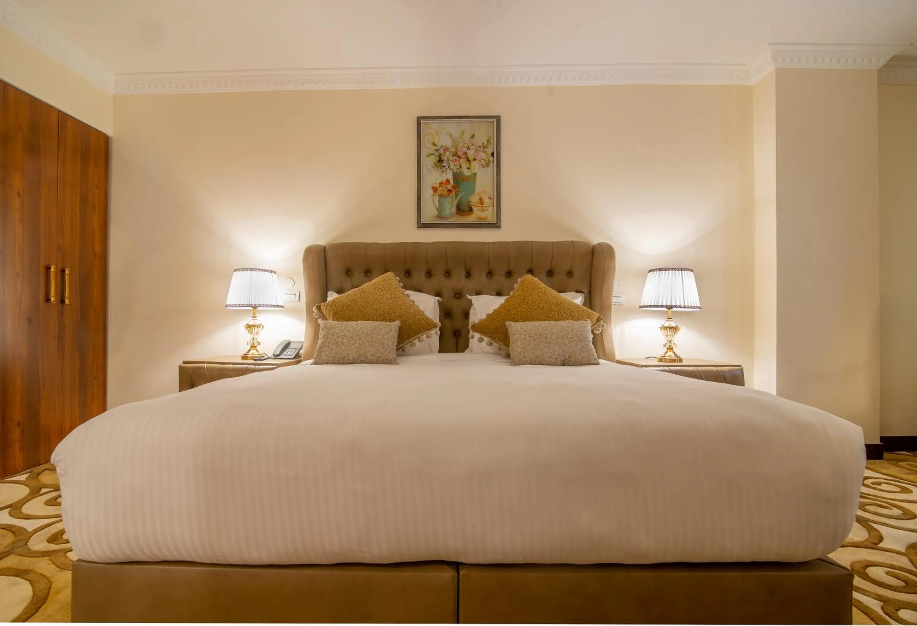 Bed in The Grand Palace Hotel