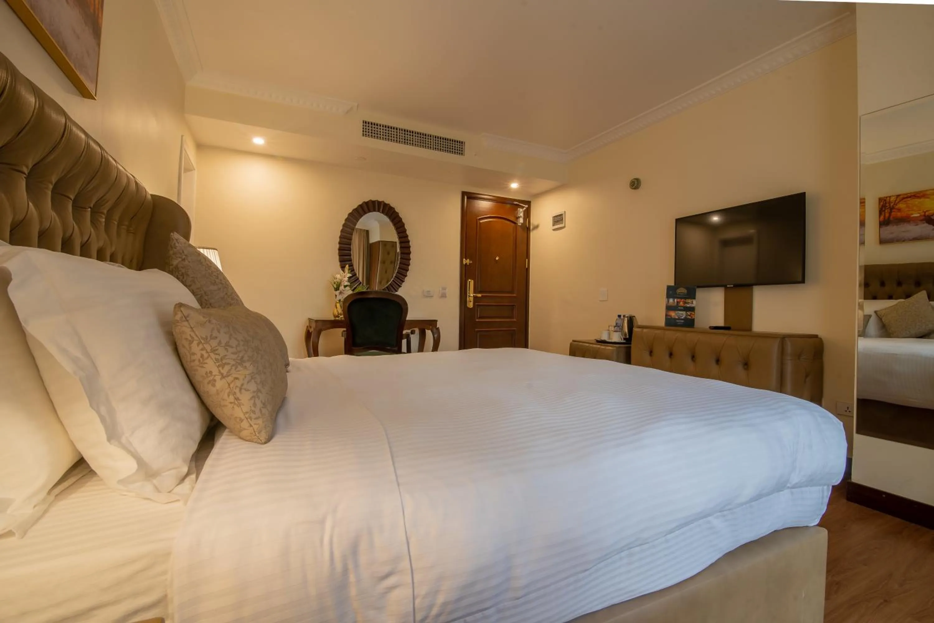 Bed in The Grand Palace Hotel