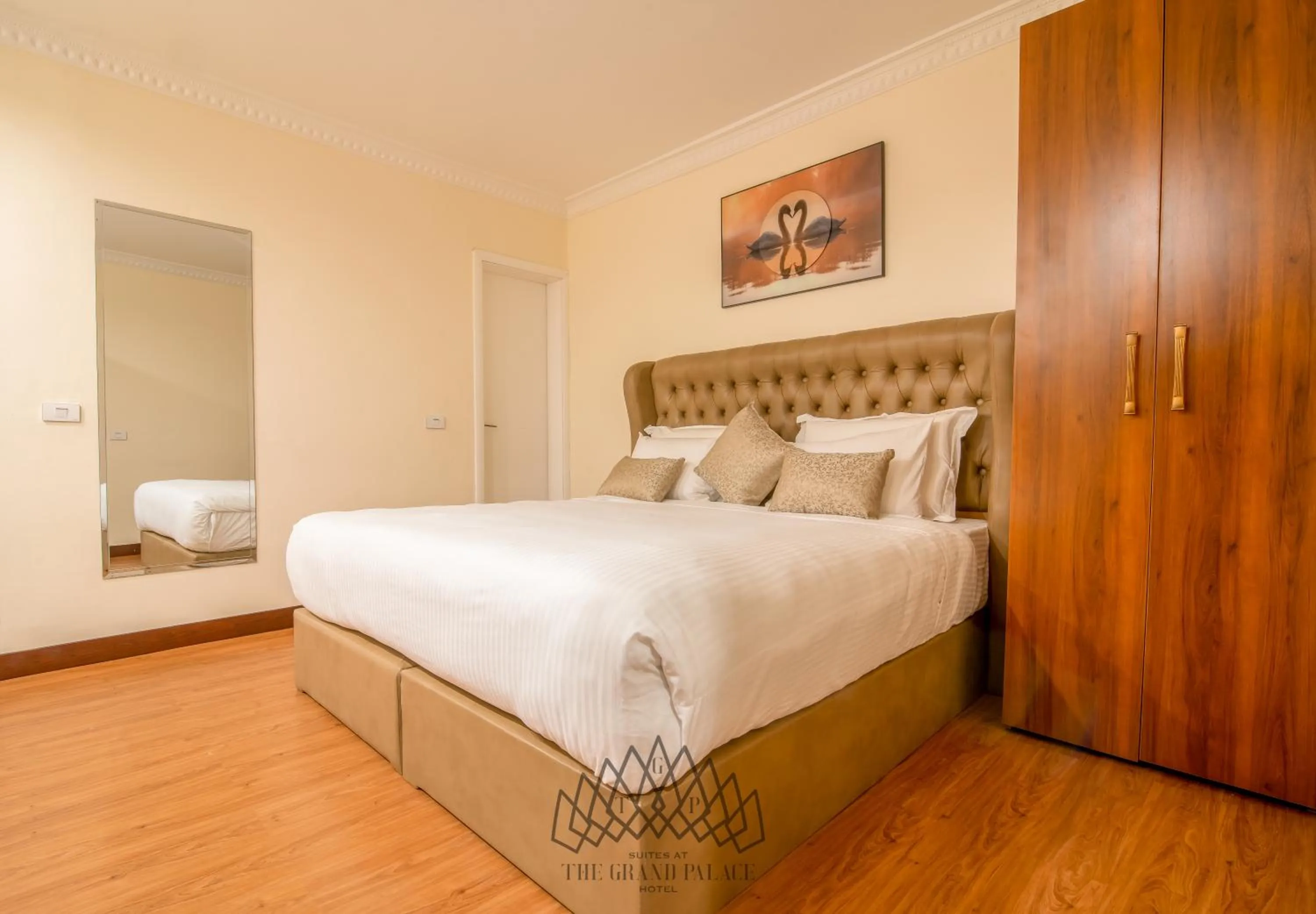 Bed in The Grand Palace Hotel