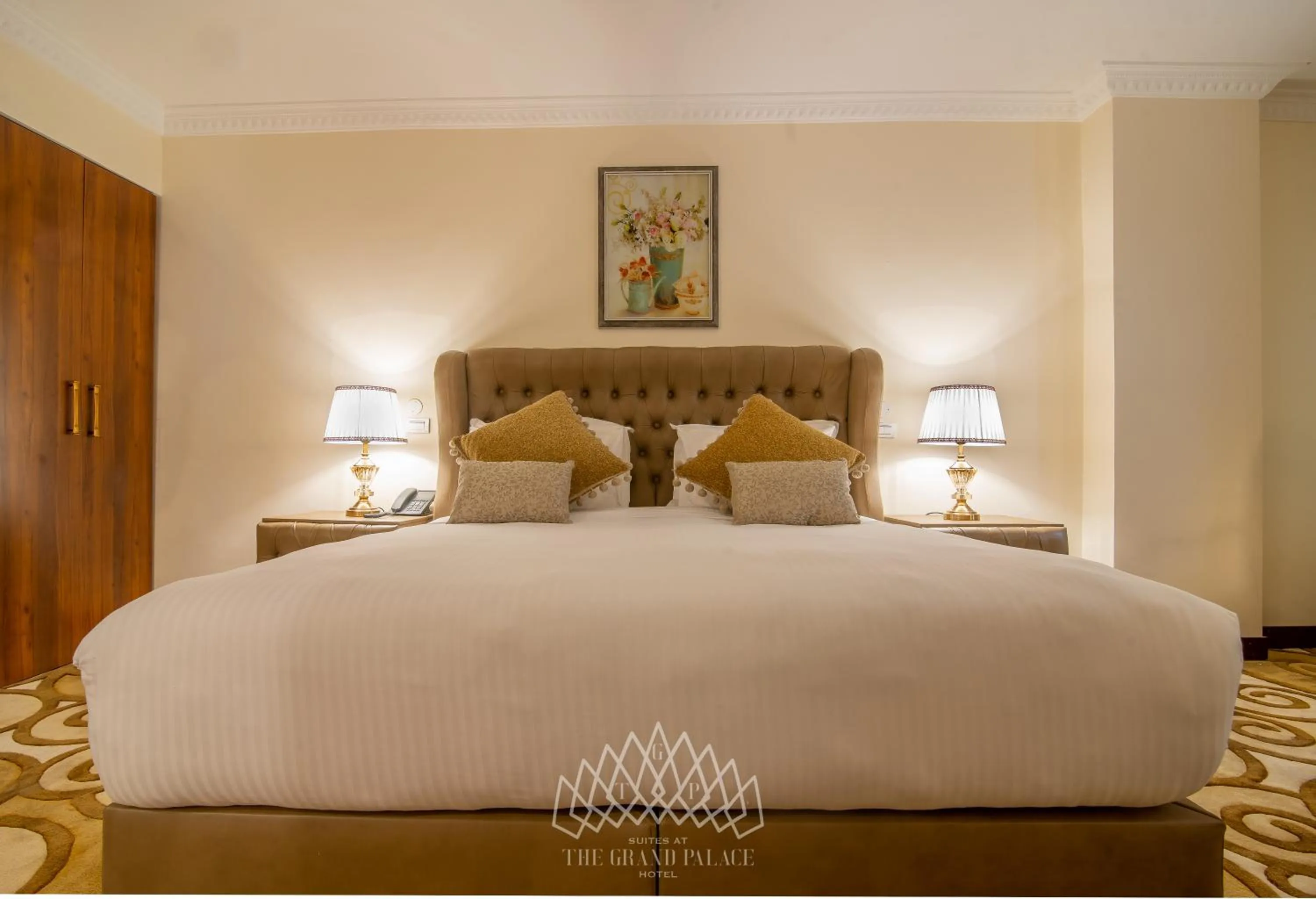 Bed in The Grand Palace Hotel