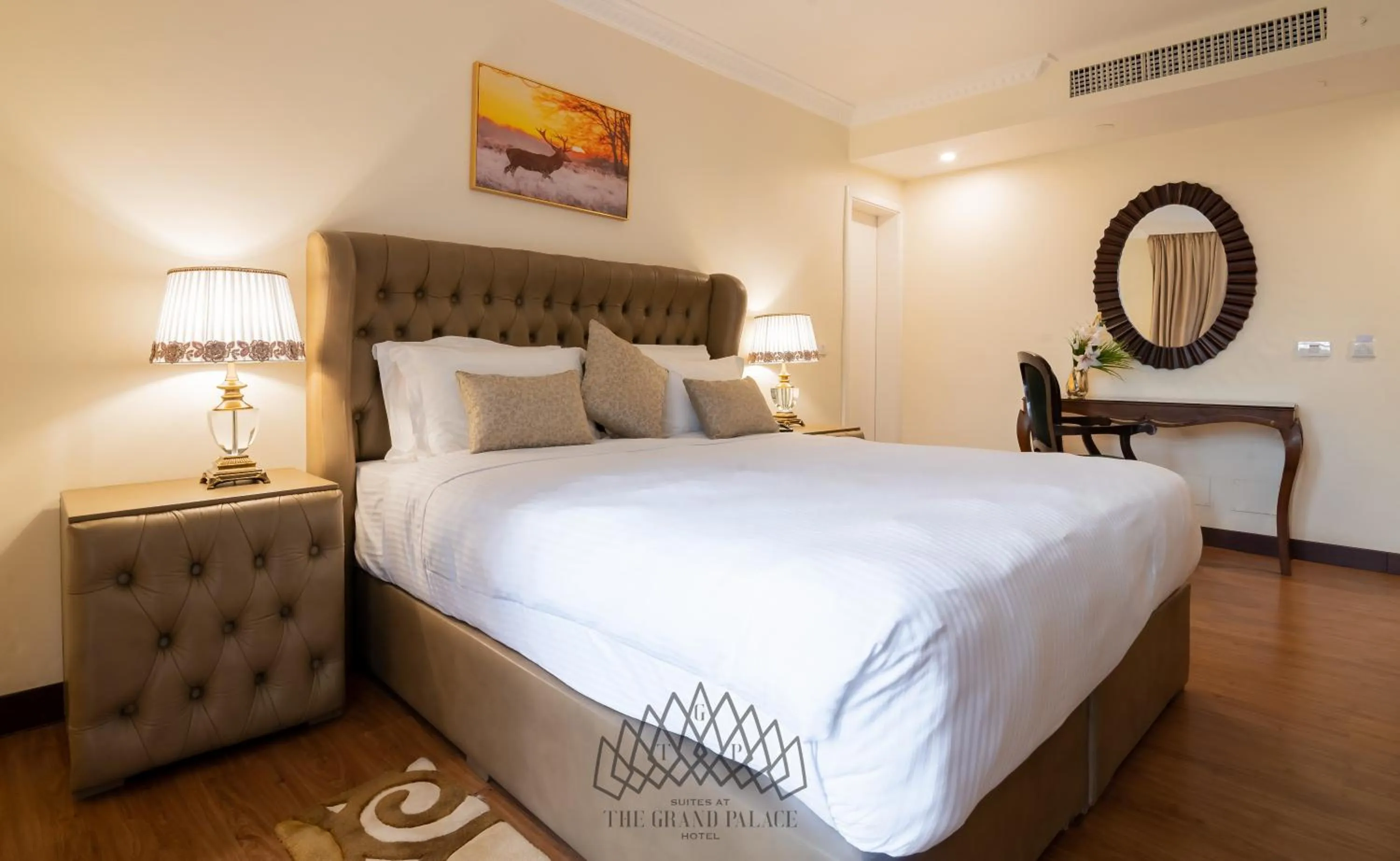 Bed in The Grand Palace Hotel