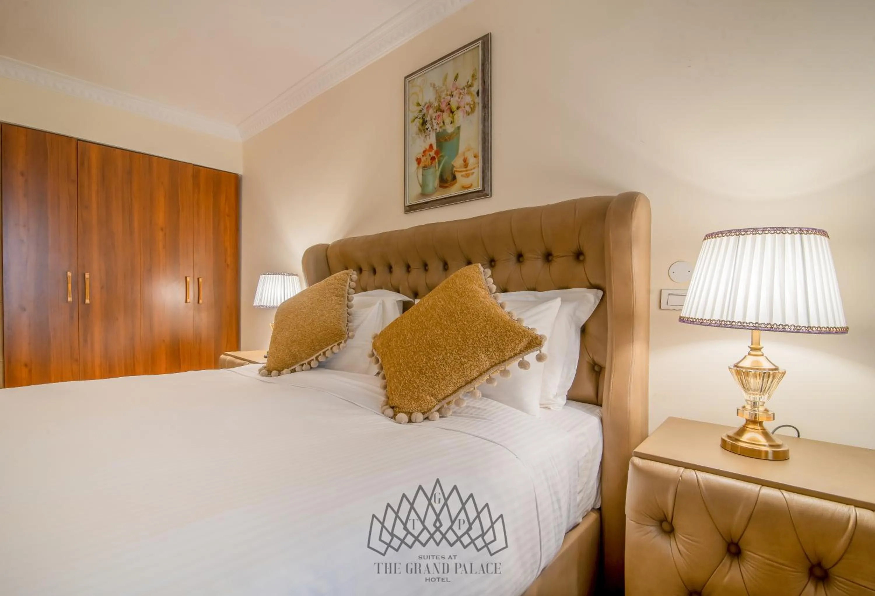 Bed in The Grand Palace Hotel