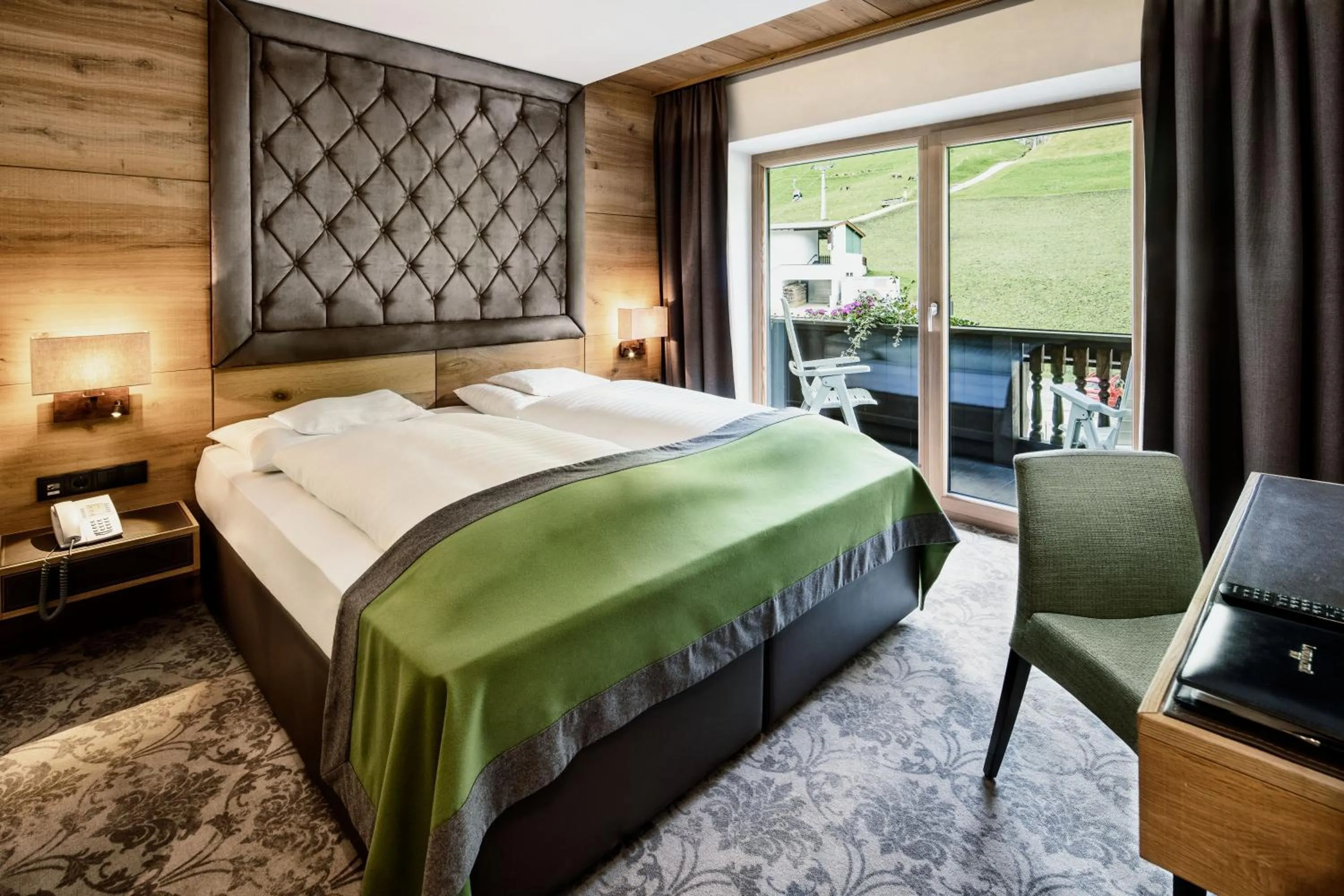 Photo of the whole room, Bed in Brugger's Genießerhotel Lanersbacherhof