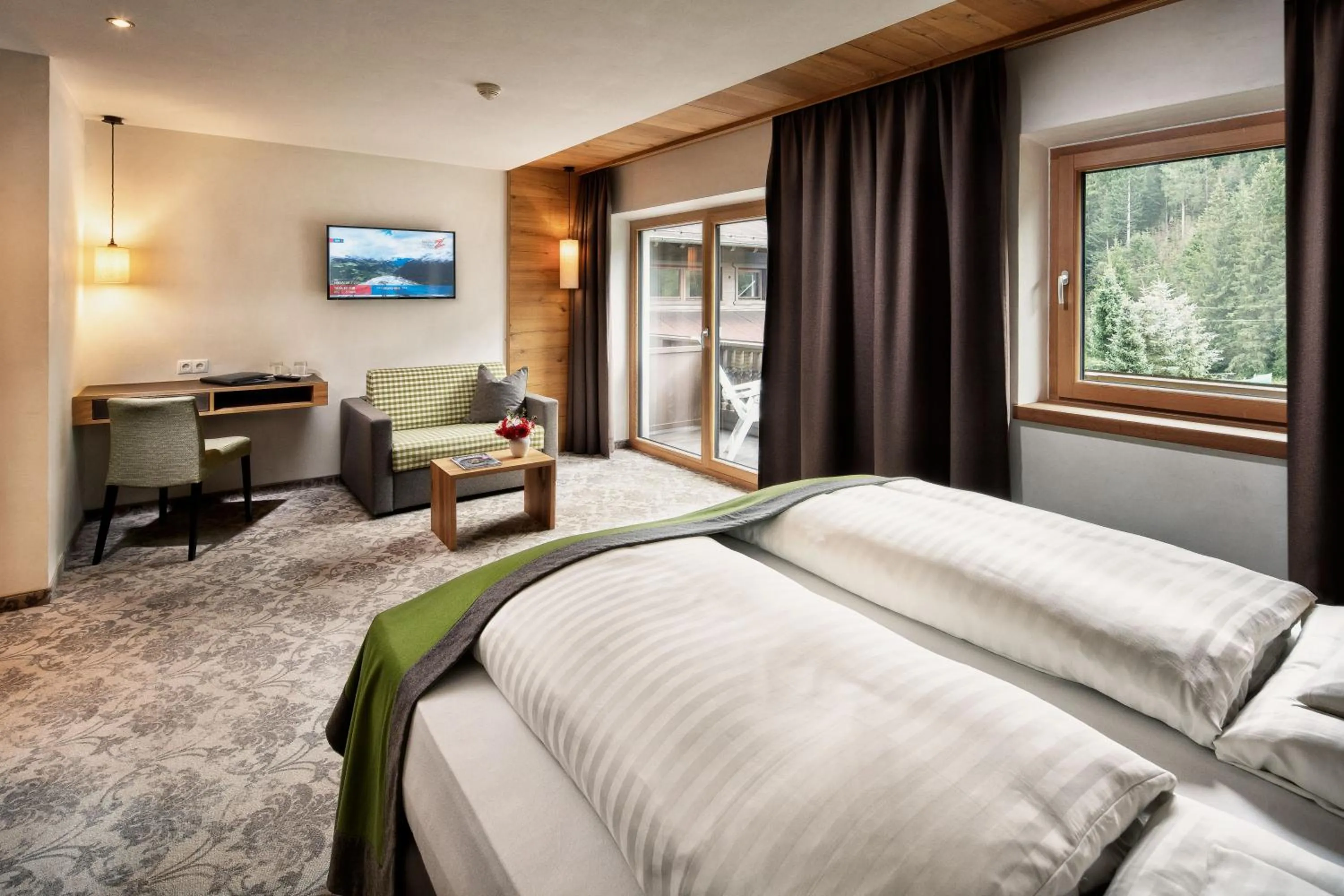 Photo of the whole room, Bed in Brugger's Genießerhotel Lanersbacherhof