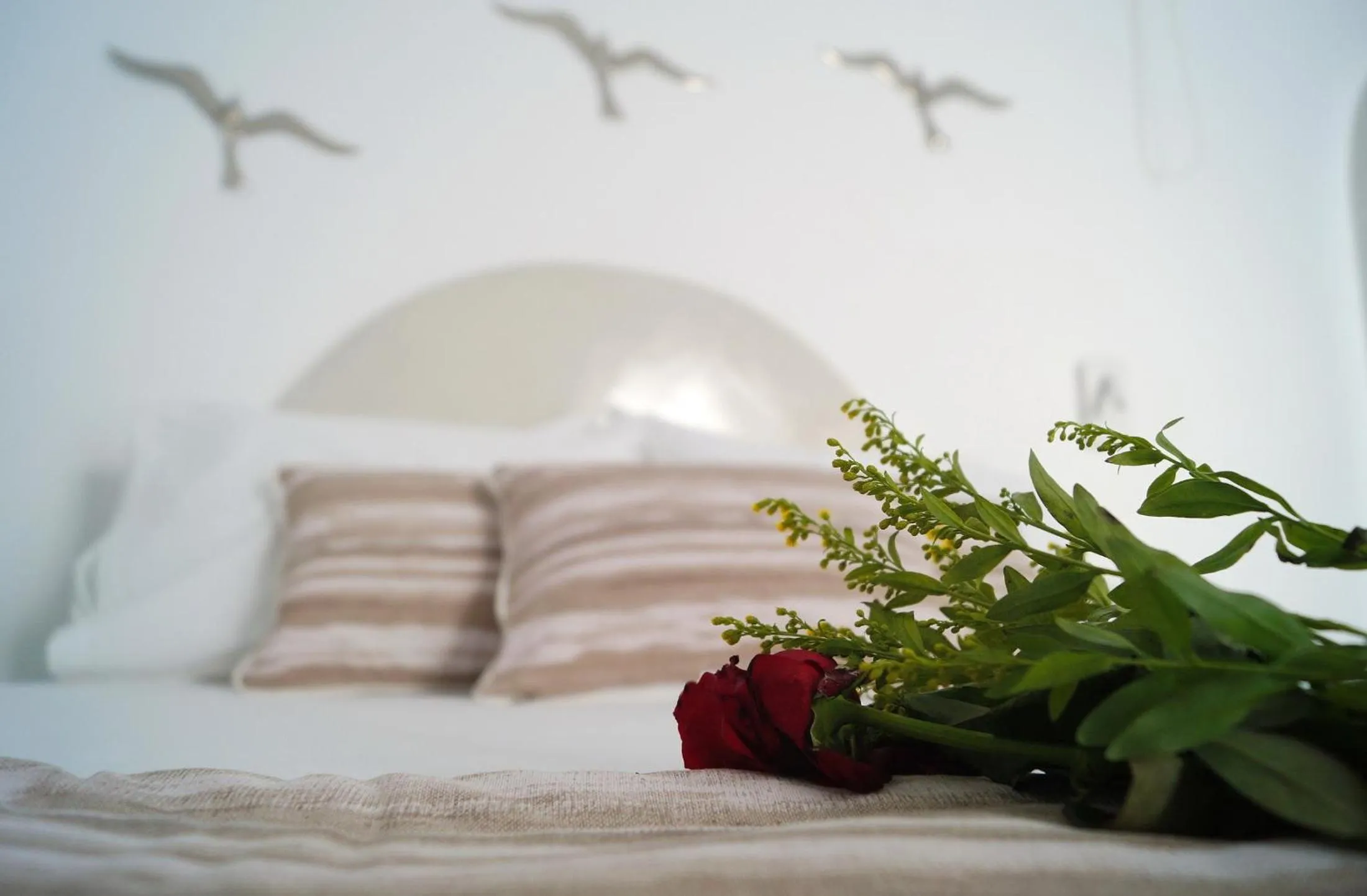 Bed in Golden Stone Santorini Suites