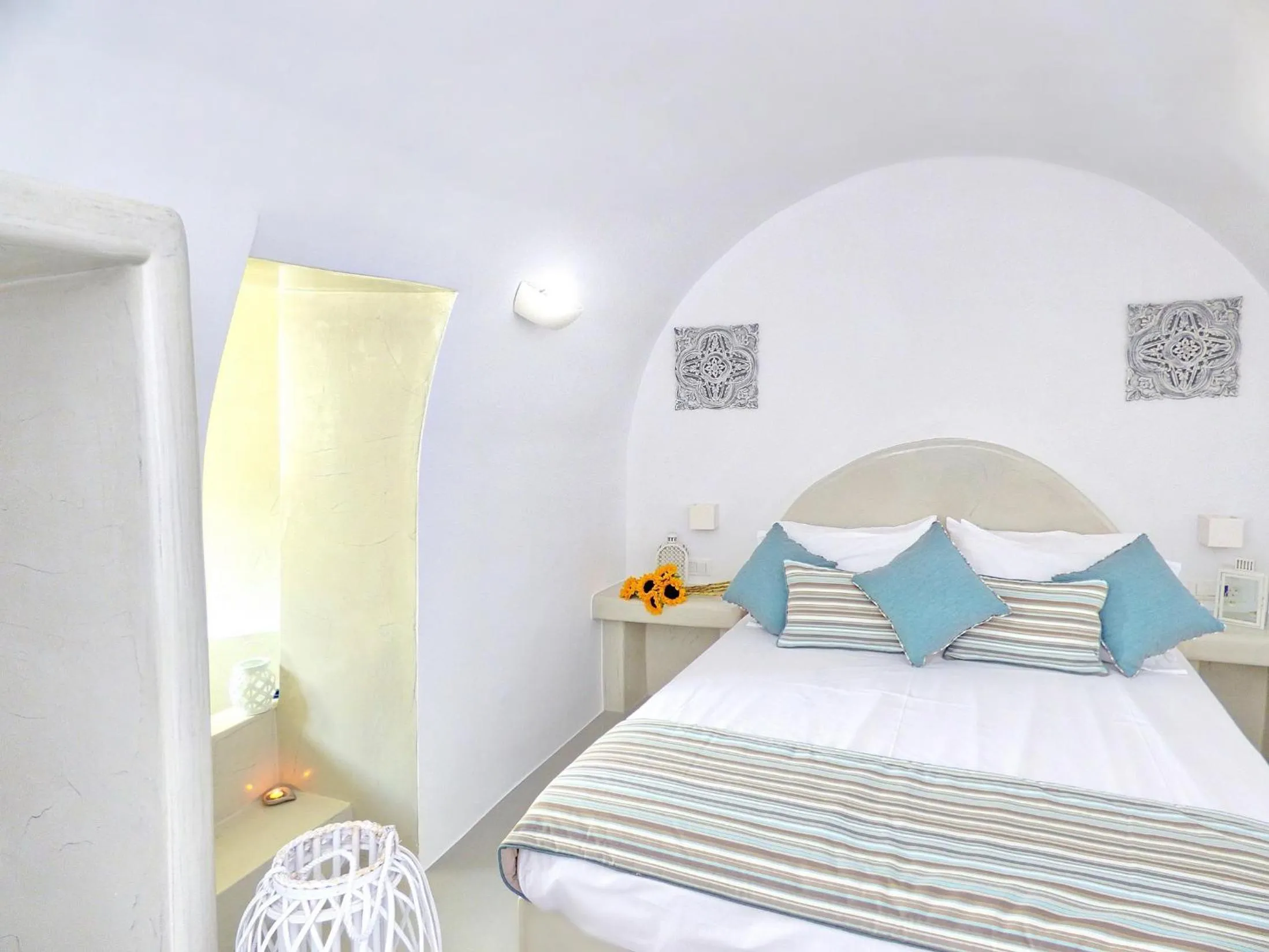 Bed in Golden Stone Santorini Suites
