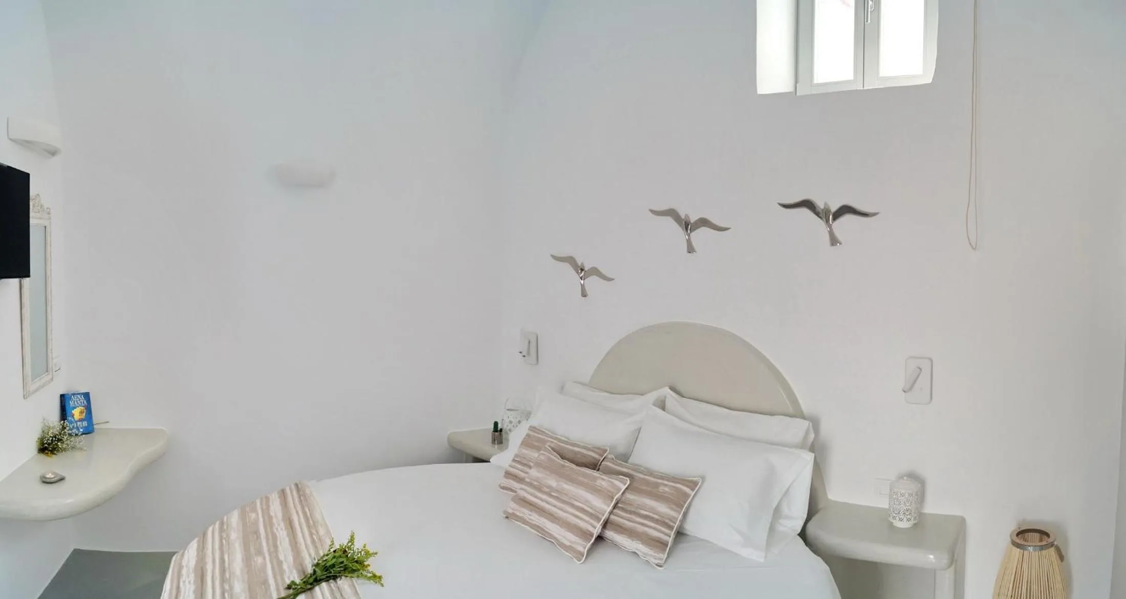 Bed in Golden Stone Santorini Suites