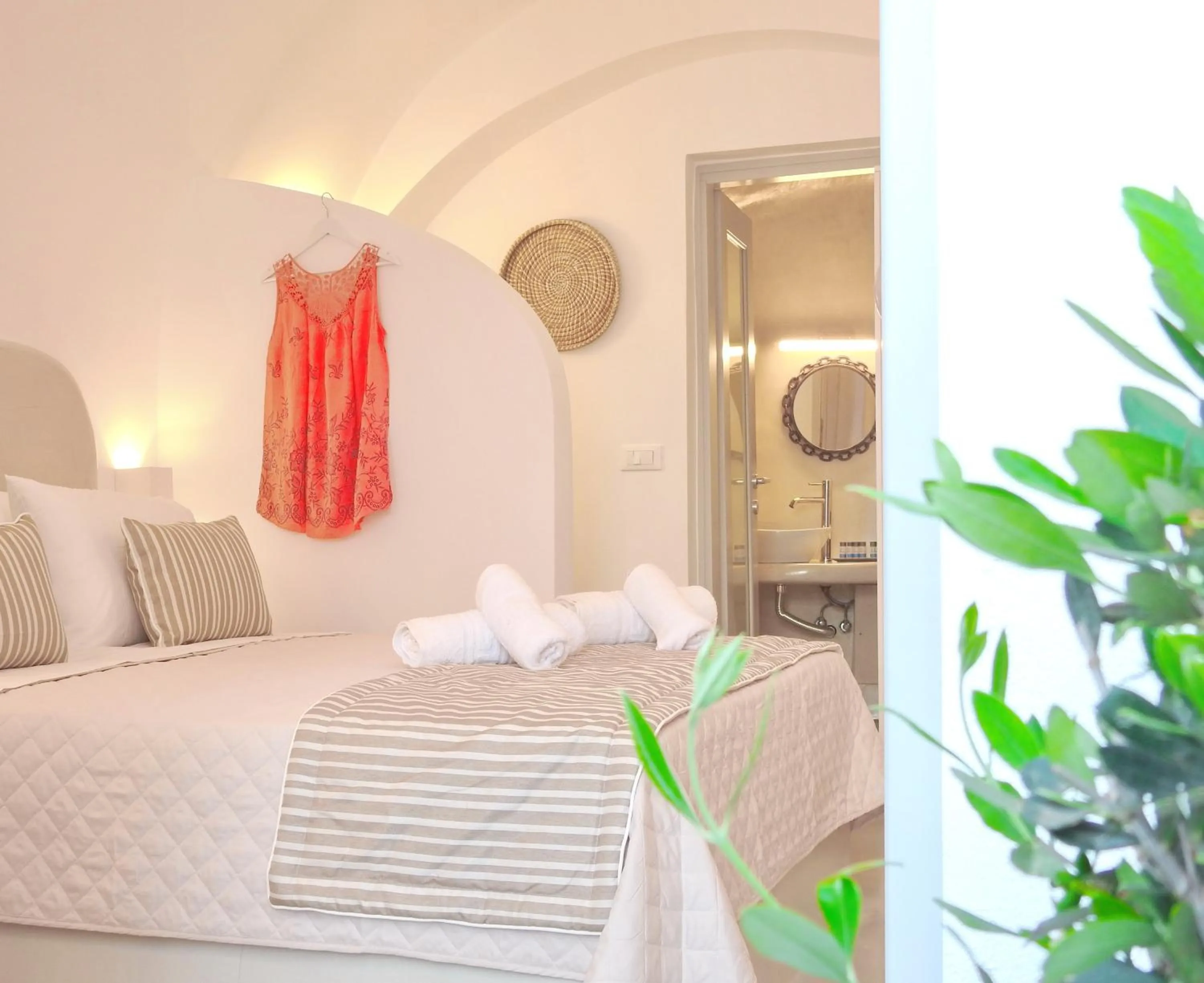 Bed in Golden Stone Santorini Suites