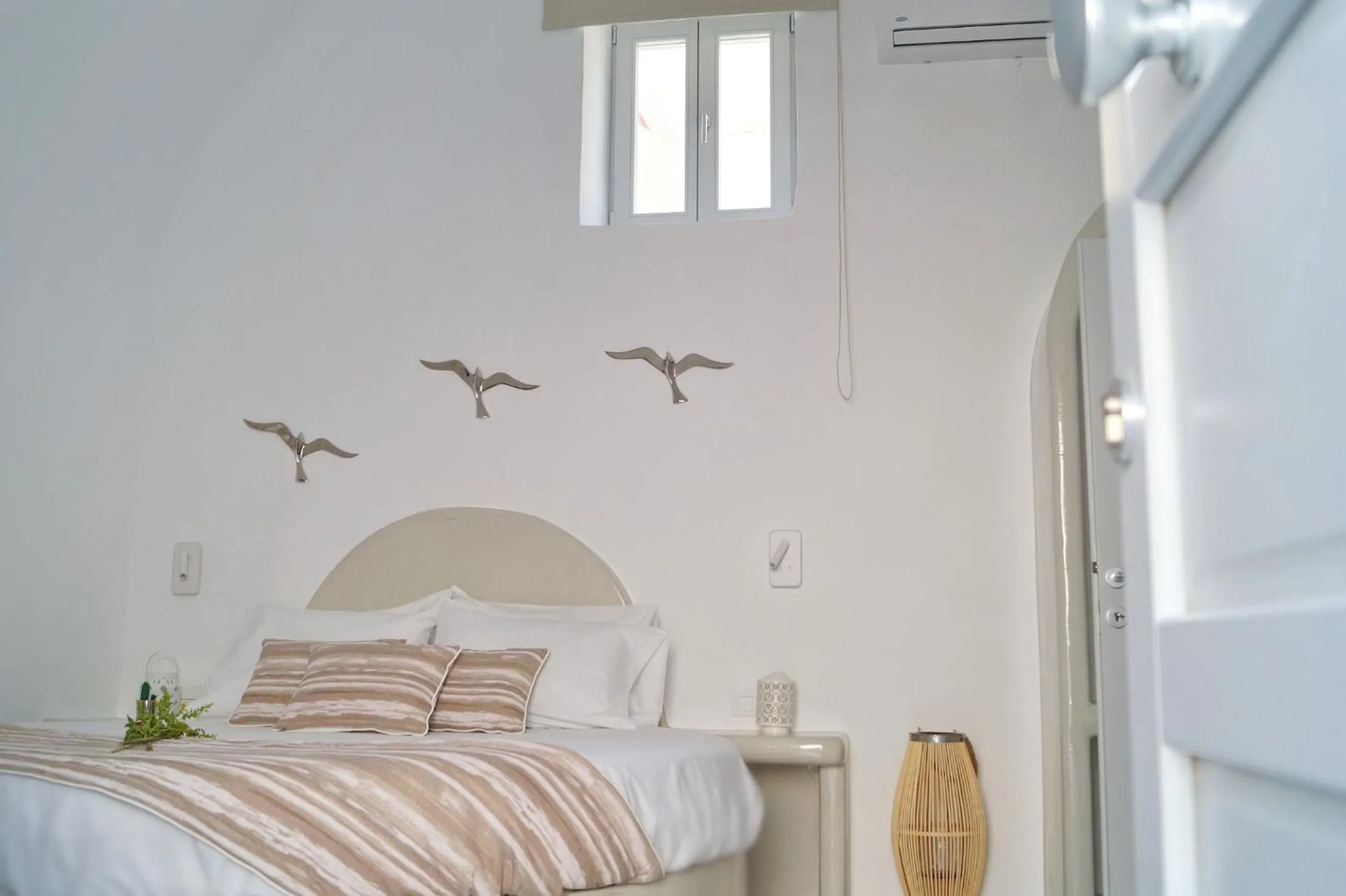 Bed in Golden Stone Santorini Suites