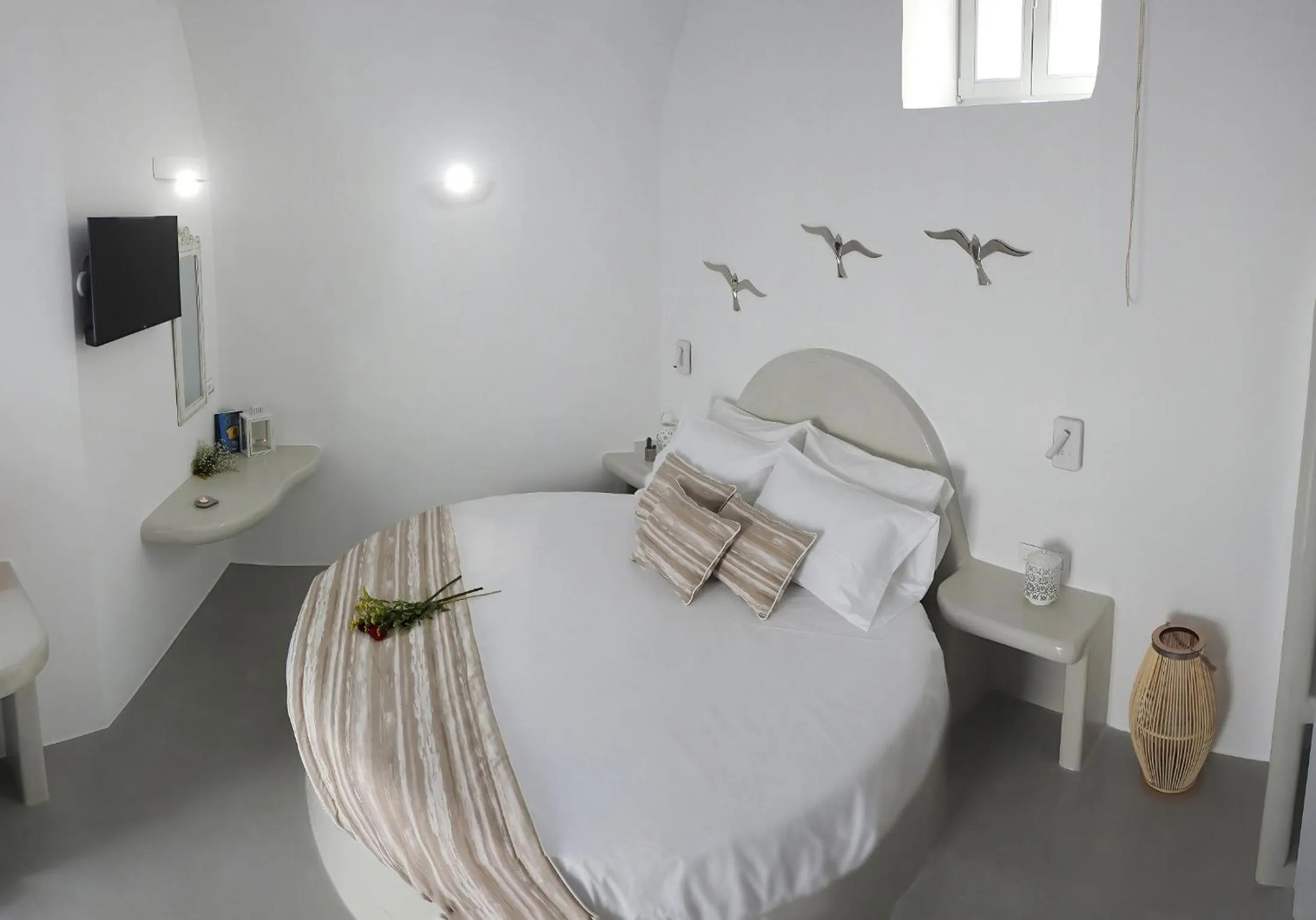 Bed in Golden Stone Santorini Suites