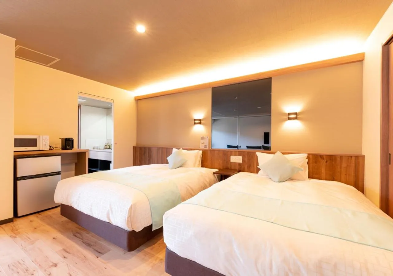 Bed in LiVEMAX RESORT Atami OCEAN