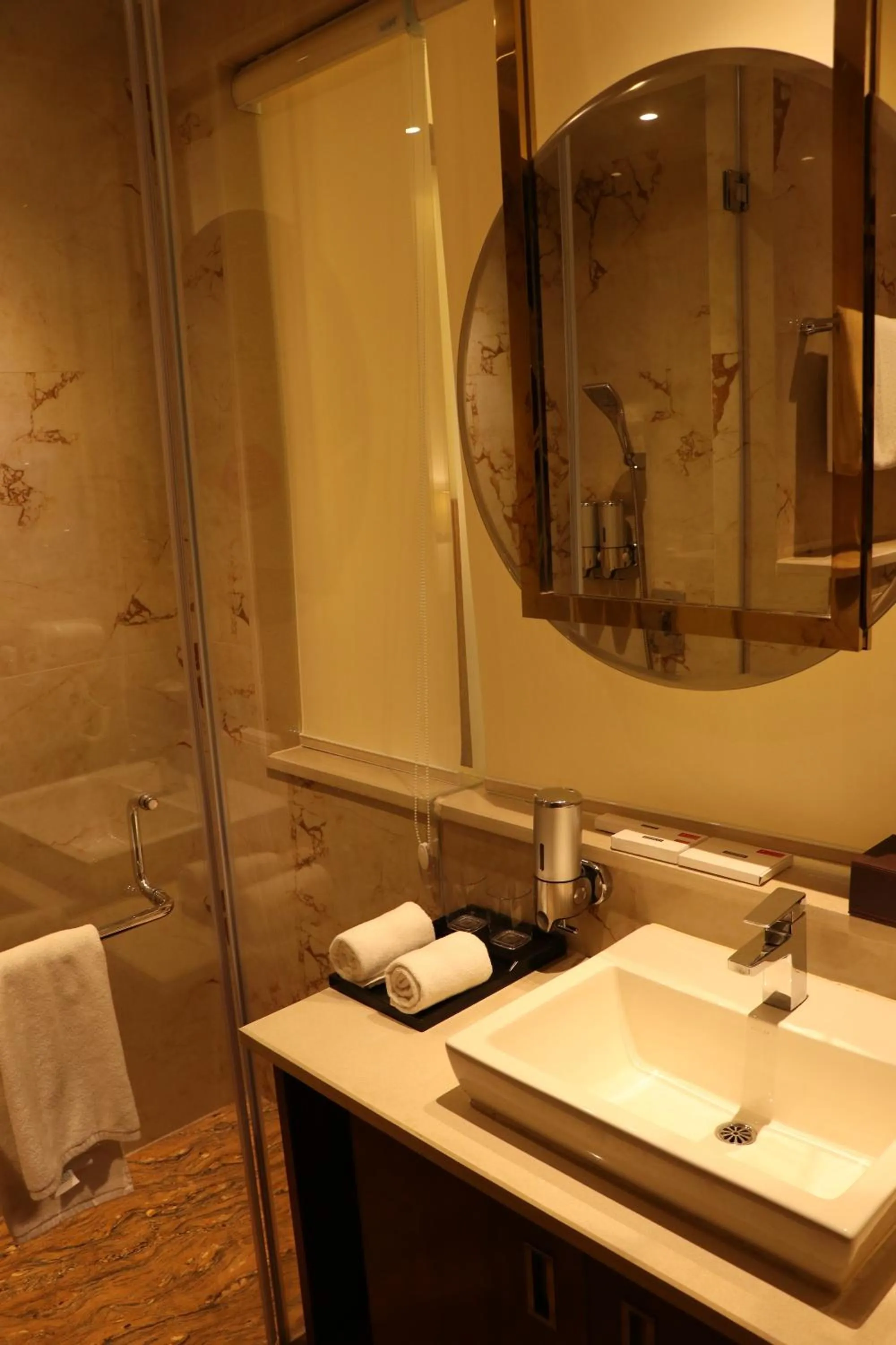 Bathroom in Regenta Inn Amristar Airport Road by Royal Orchid Hotels Limited