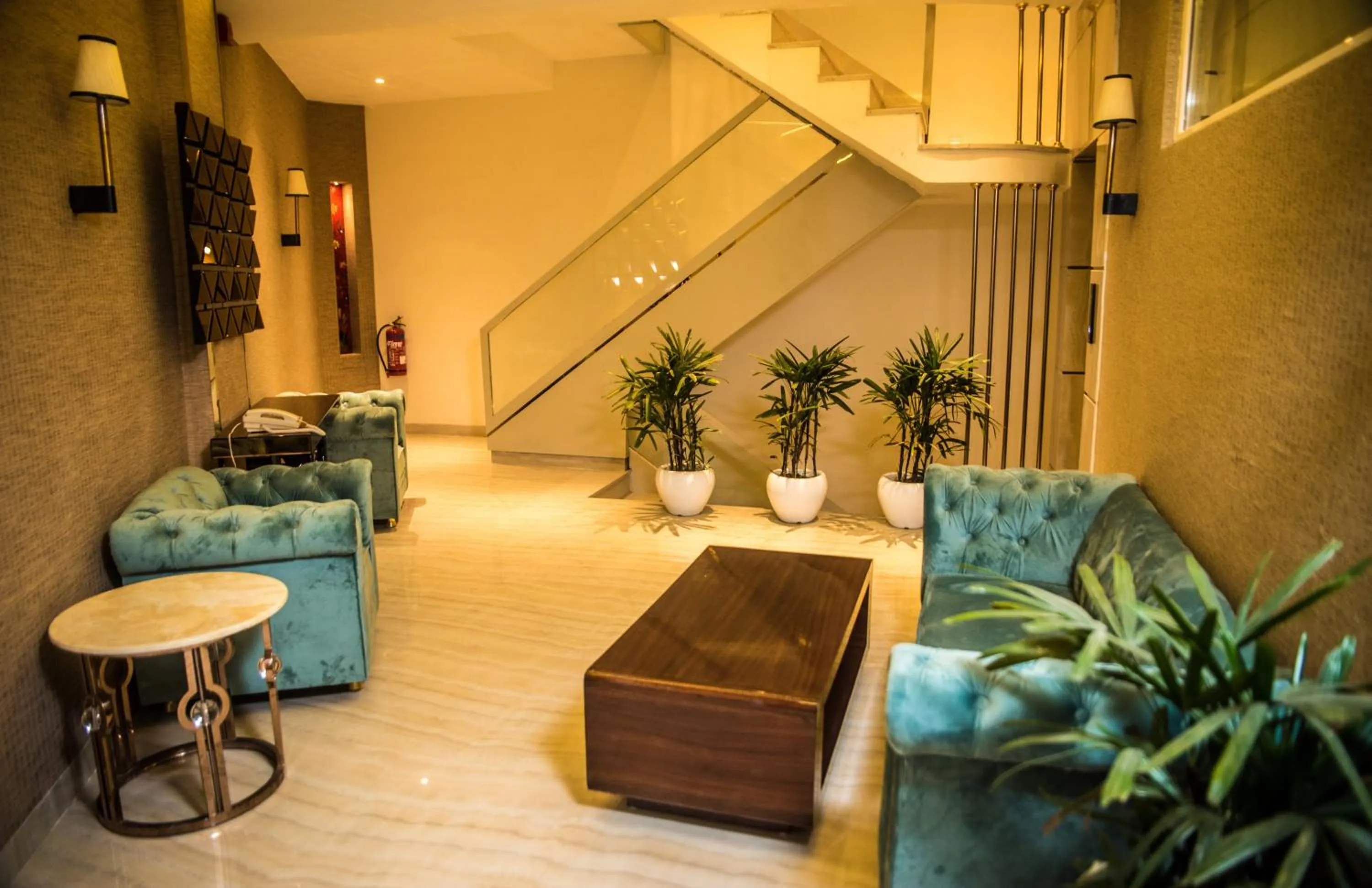 Seating area in Regenta Inn Amristar Airport Road by Royal Orchid Hotels Limited