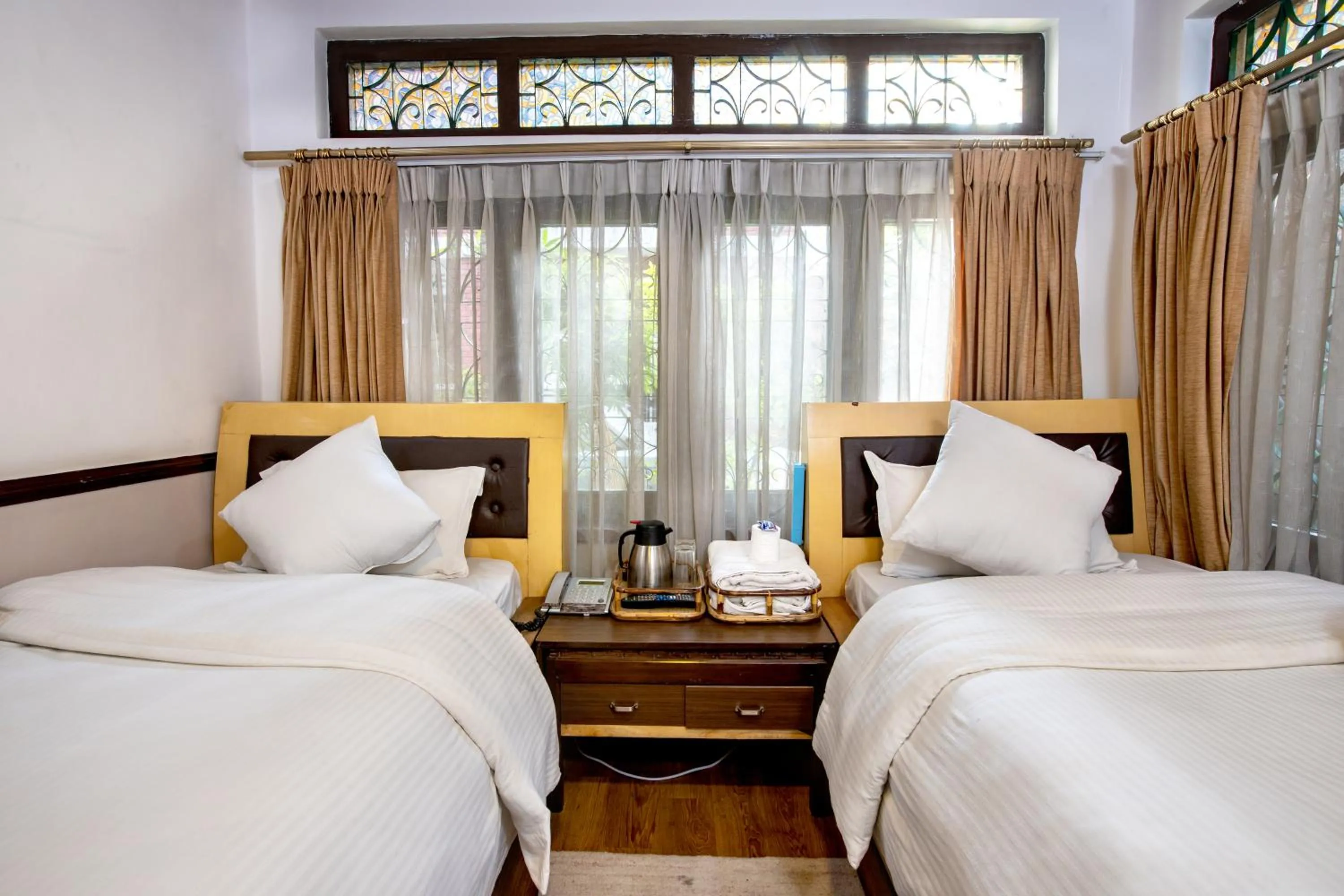 Bed in Shangrila Boutique Hotel