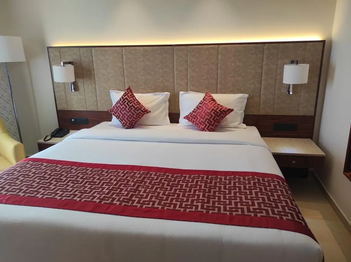 Bed in AARYA MANSION V One Hotel