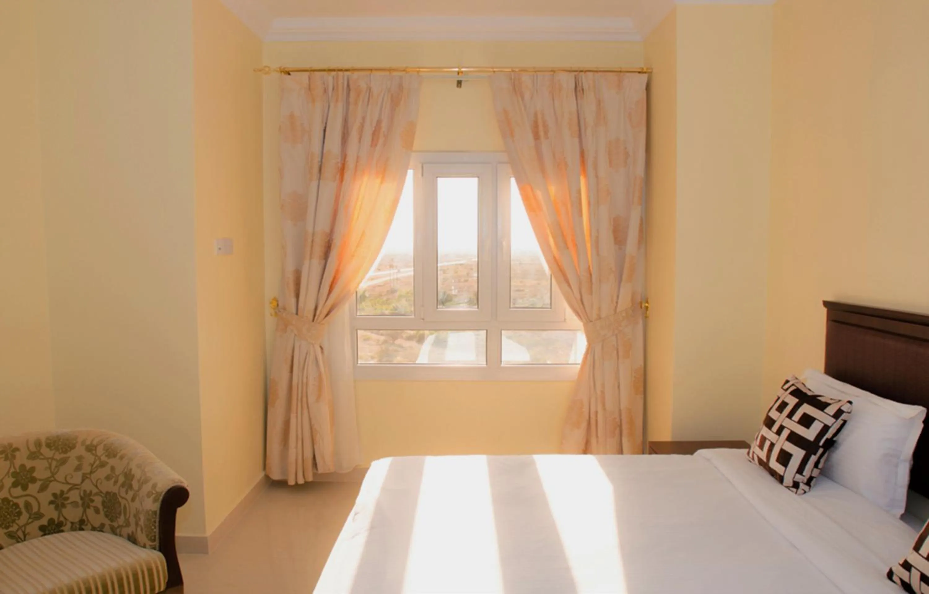 View (from property/room), Bed in Nizwa Hotel Apartments