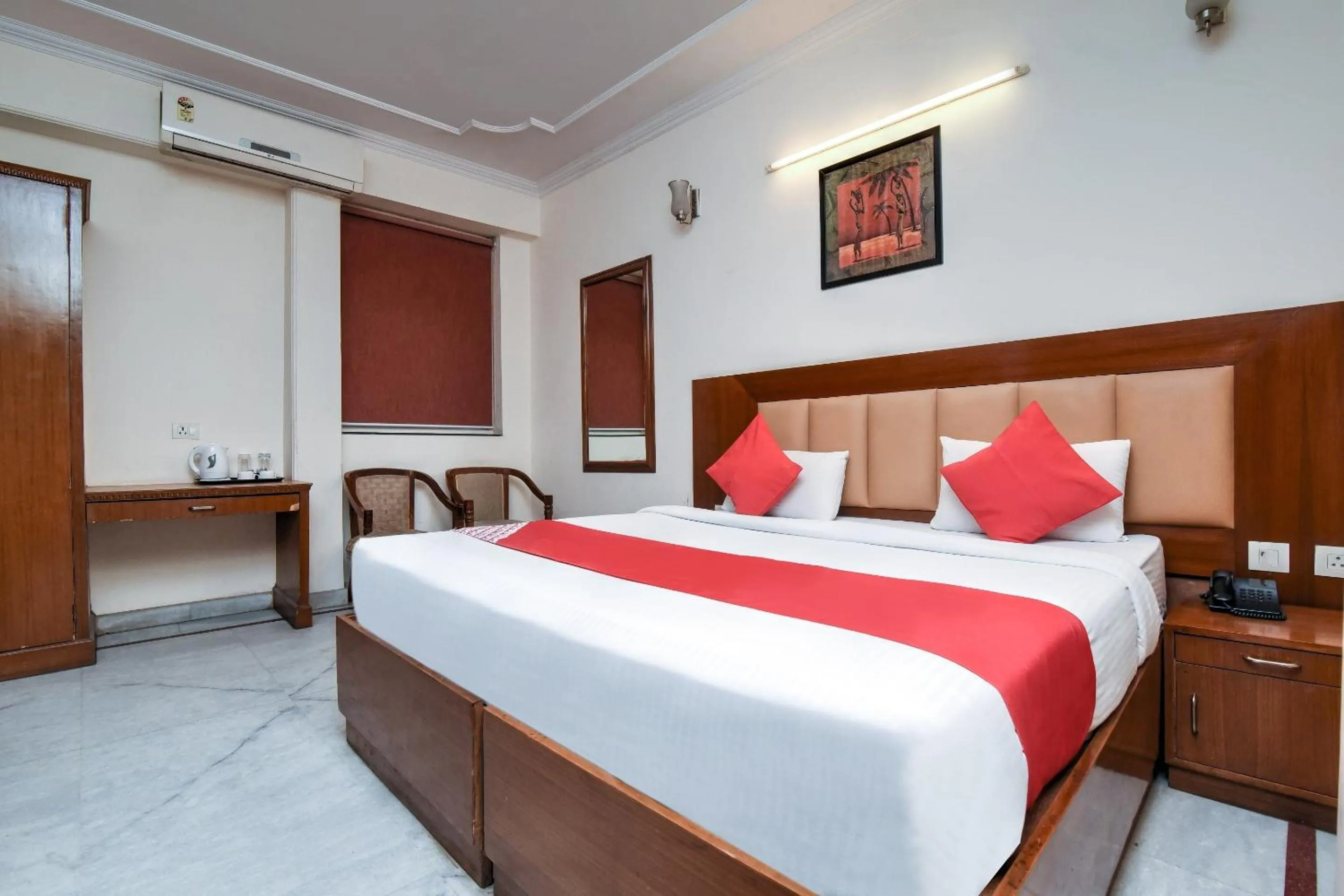 Bedroom in Capital O Corporate Inn