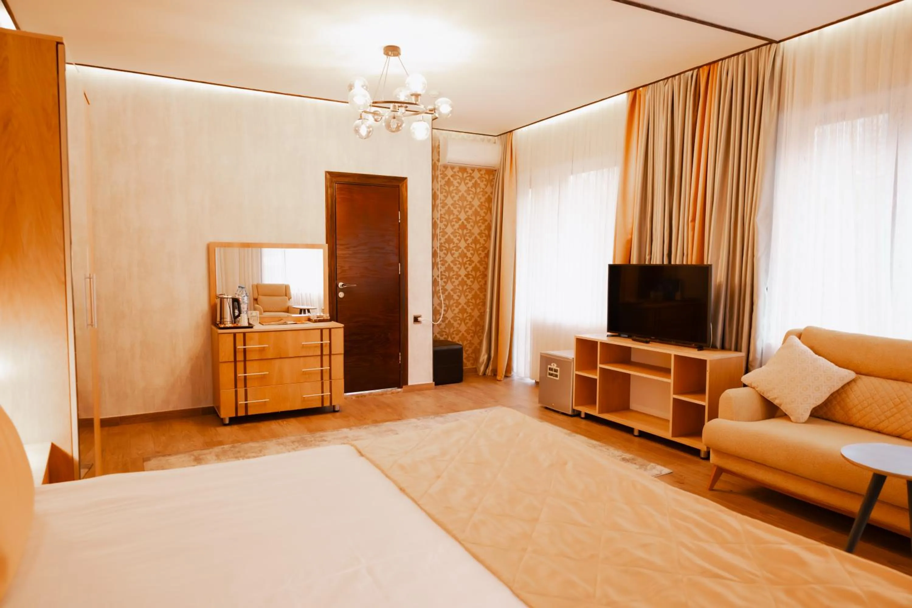 Communal lounge/ TV room, Bed in Quba Vadi Chalet Hotel