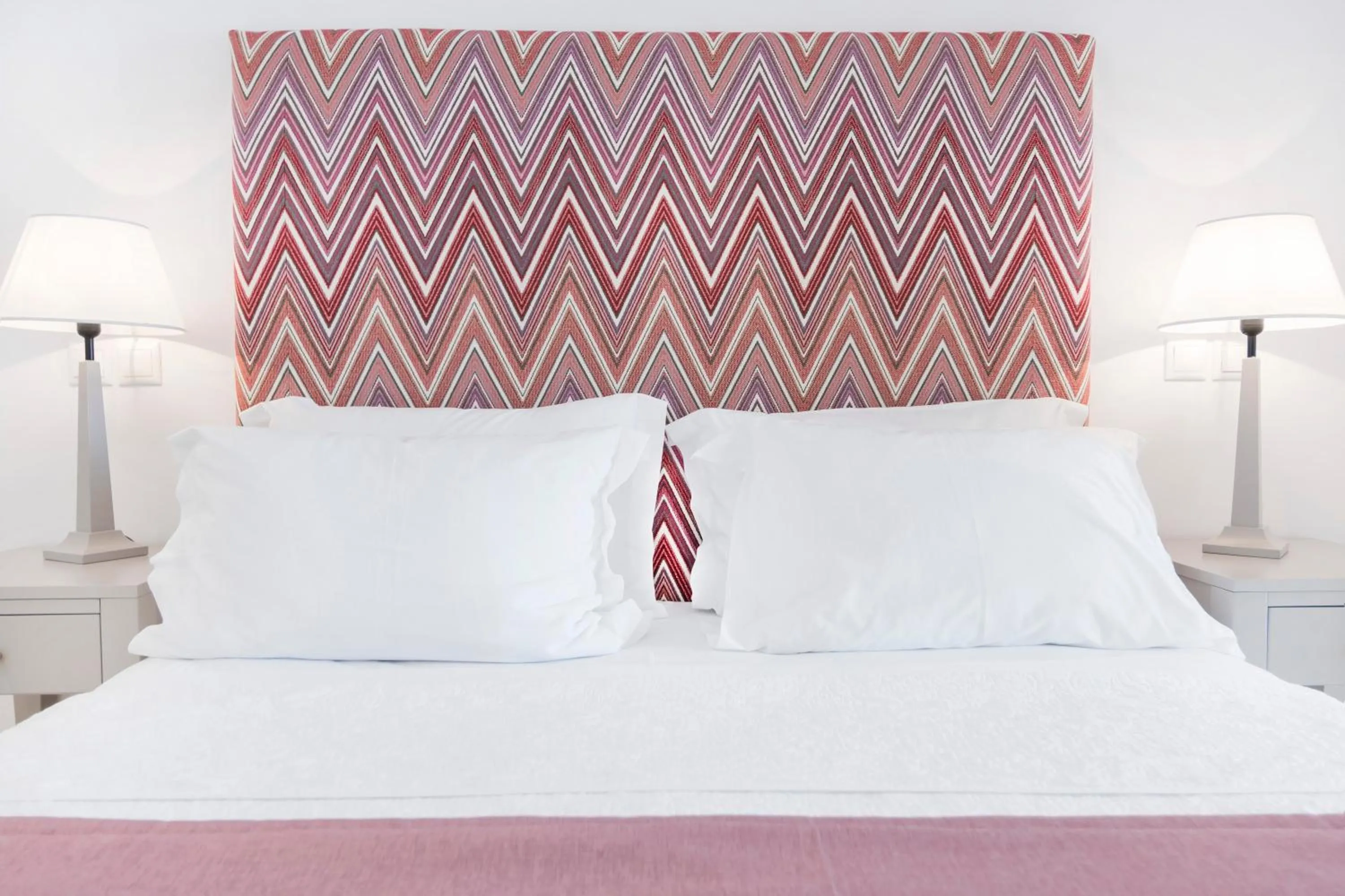 Bed in Stelia Mare Boutique Hotel