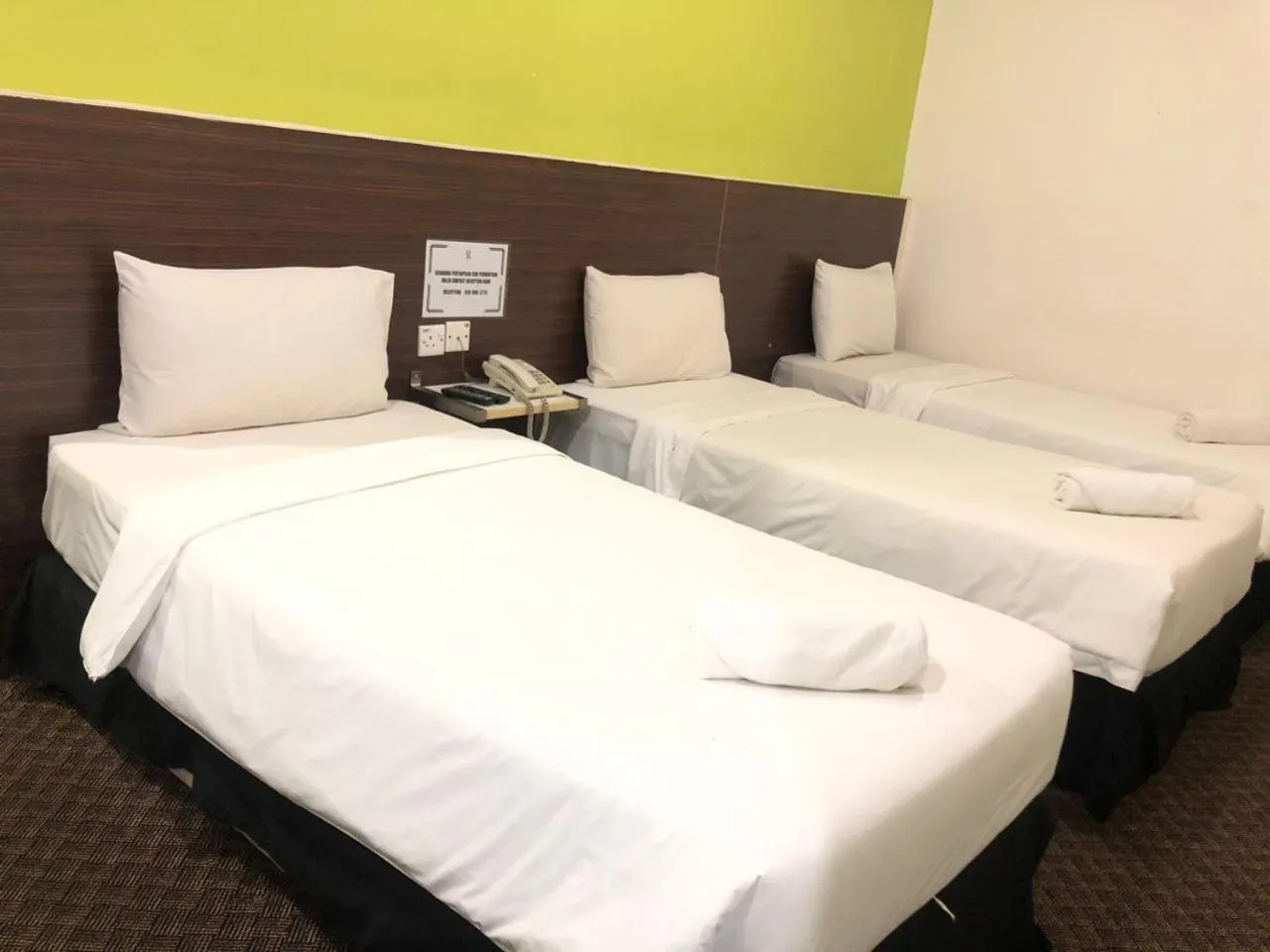 Bed in Ridel Sunset Hotel