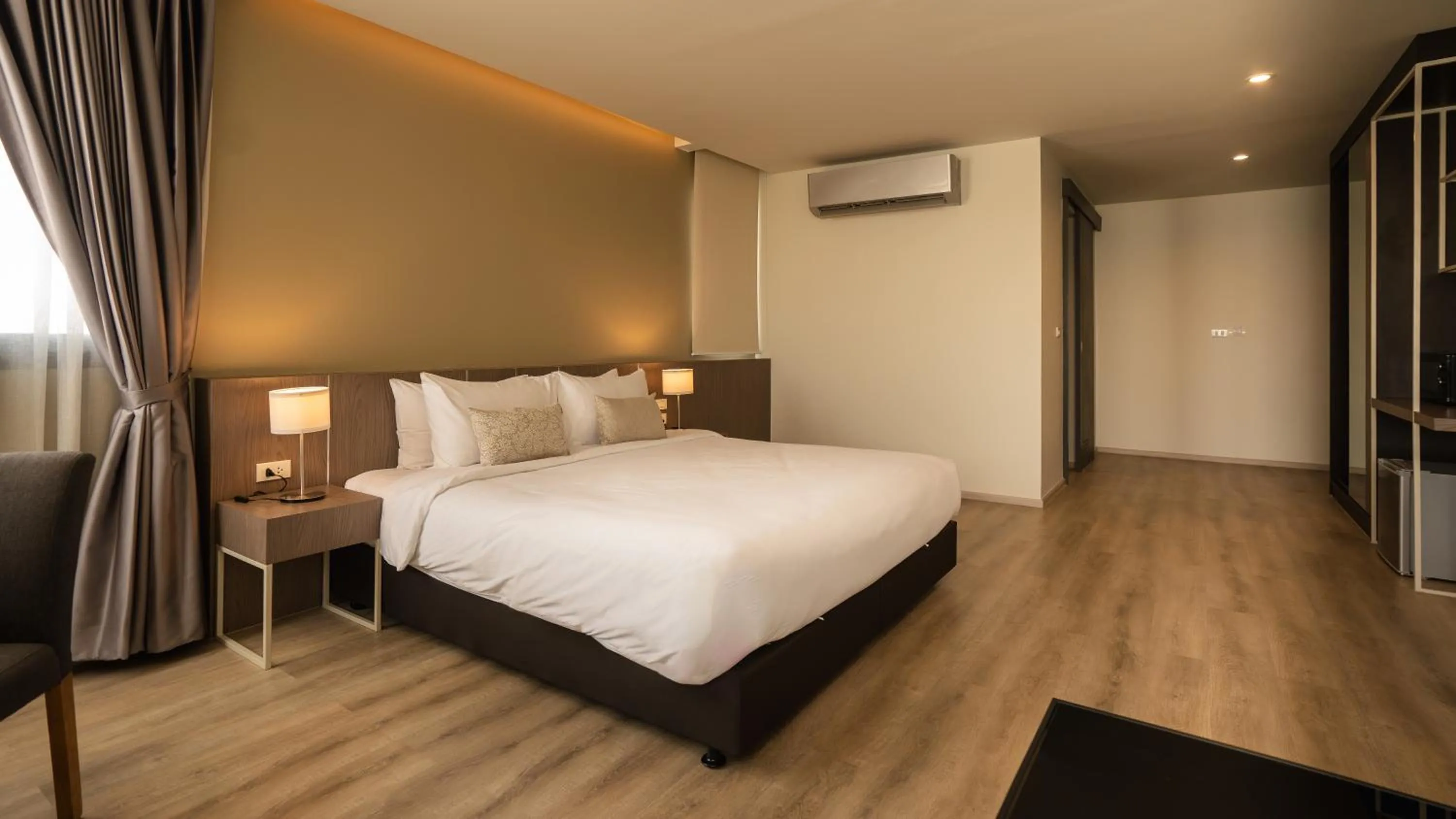 Bed in The Rise Suites Hotel, Chiang Mai - SHA Extra Plus