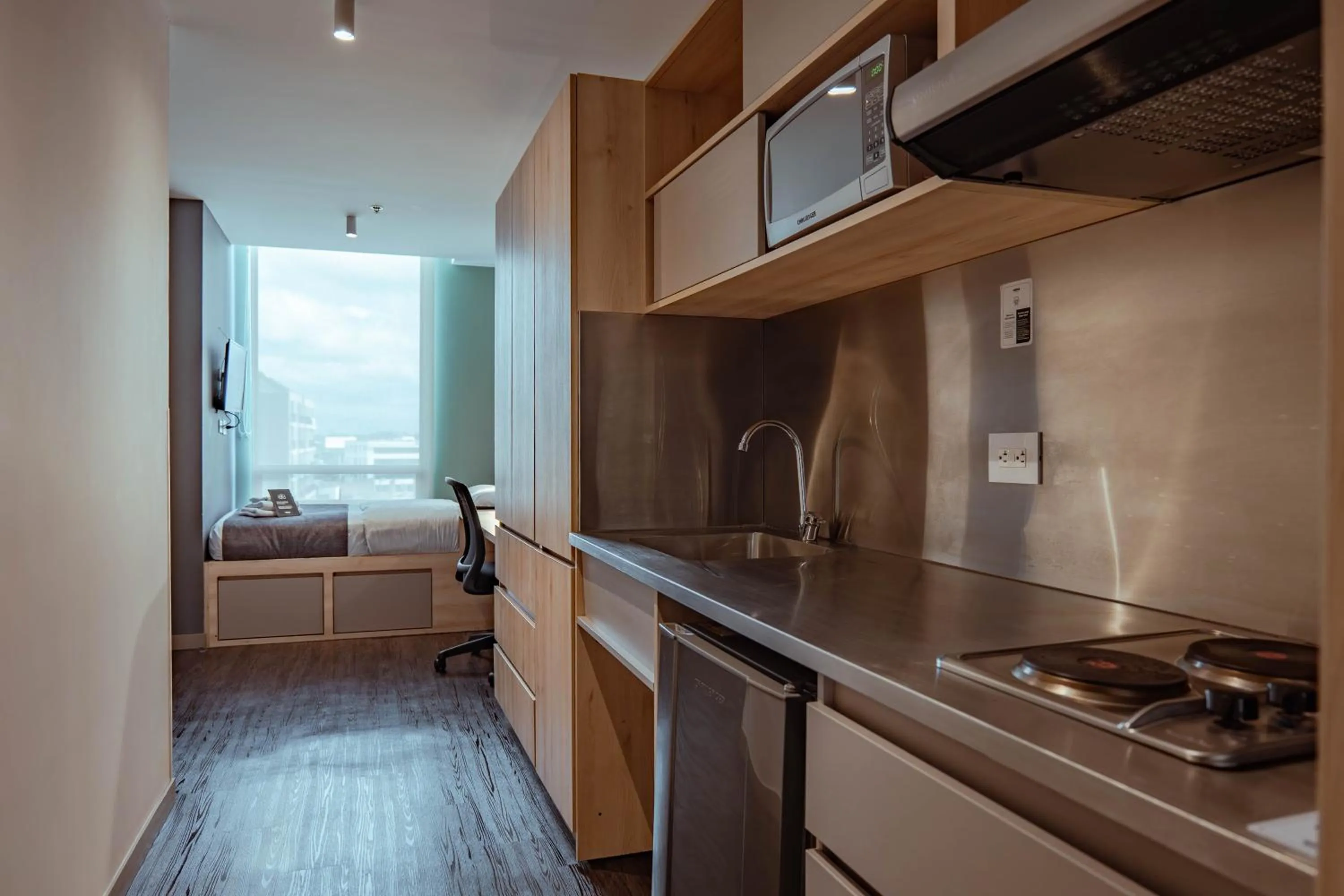 kitchen, Bed in UMA Suites Chia