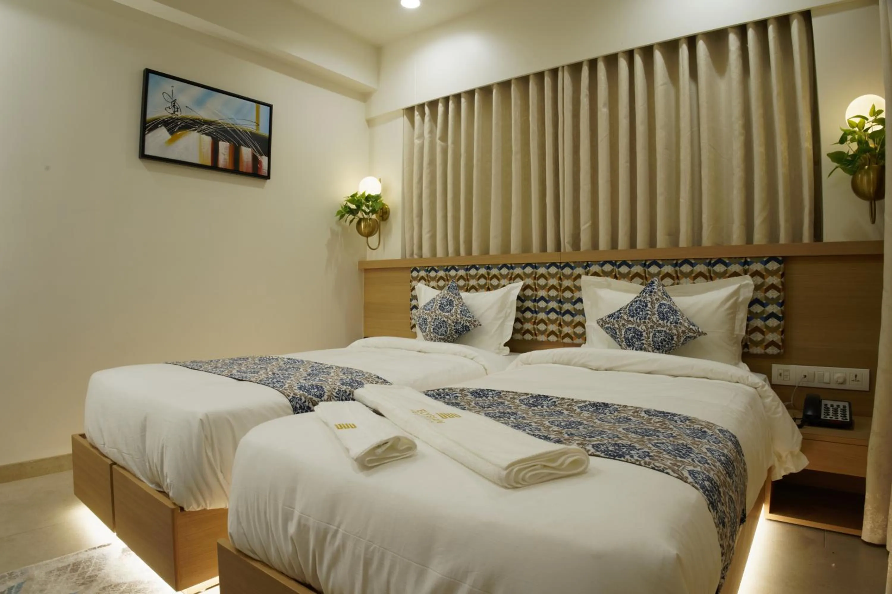Bed in Hotel Elysian Residency