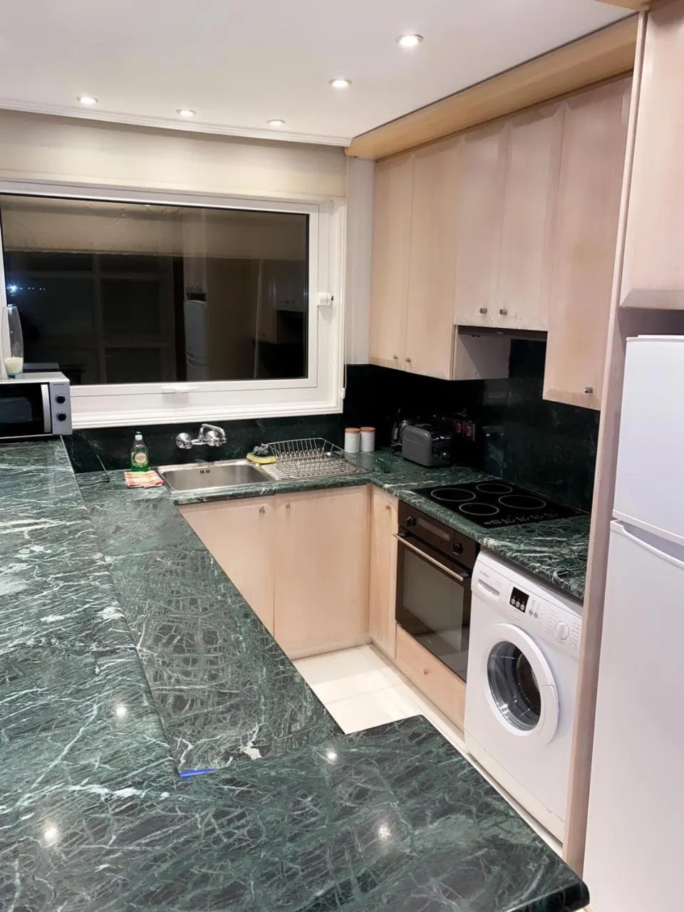 Kitchen or kitchenette in Larnaca Seaview Rooms