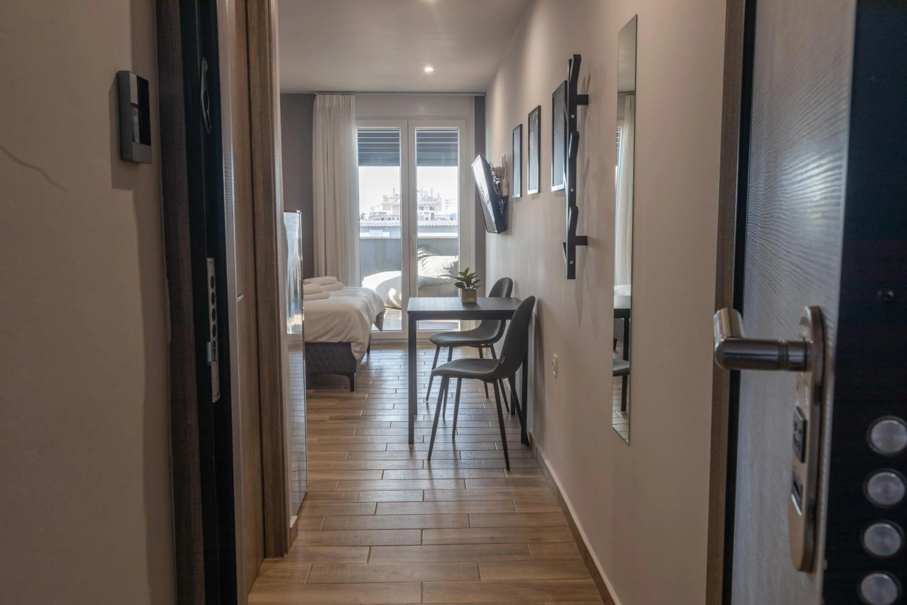 Seating area, Bed in Raise Athens Metro Apartments