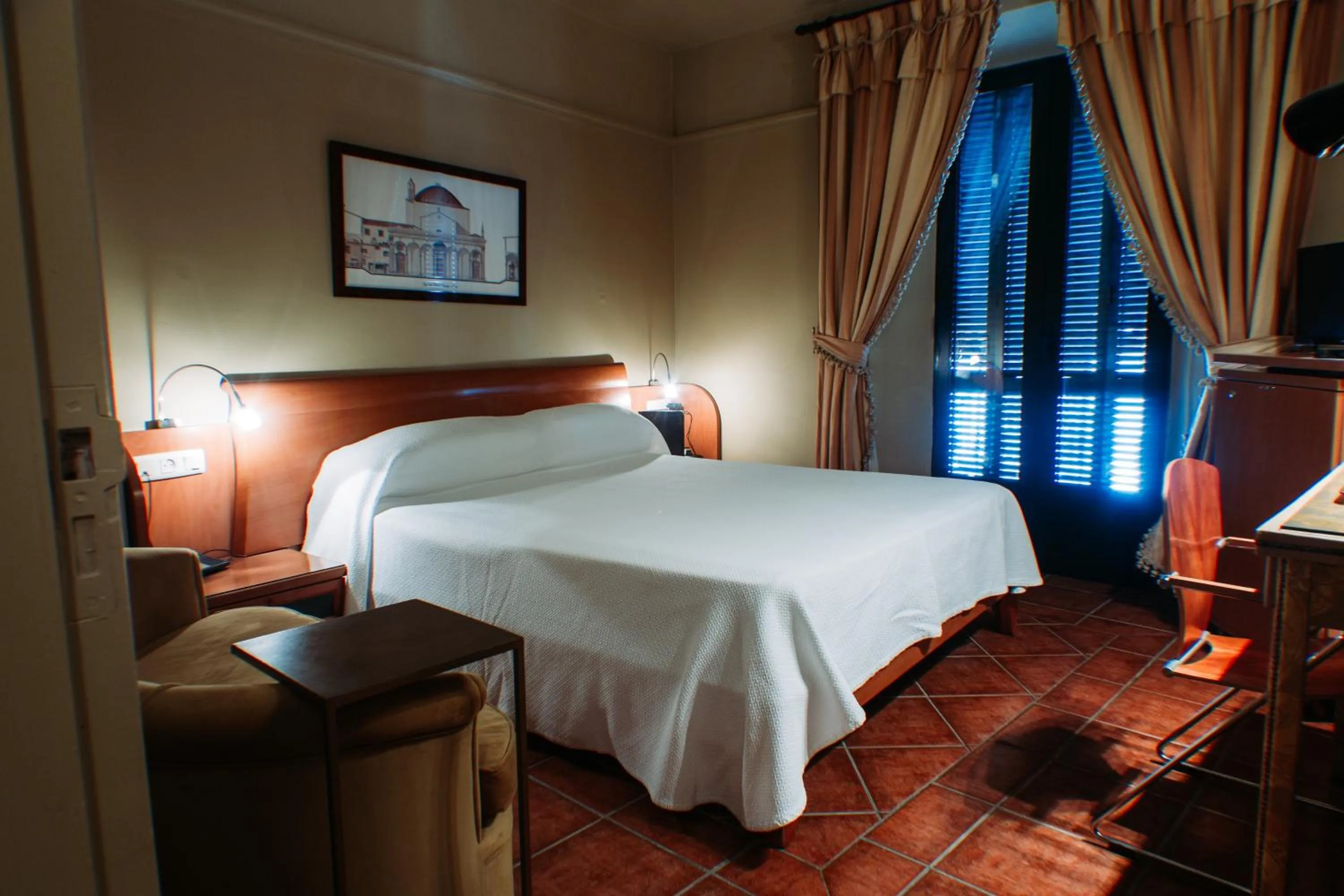 Bed in Hotel Carabeo