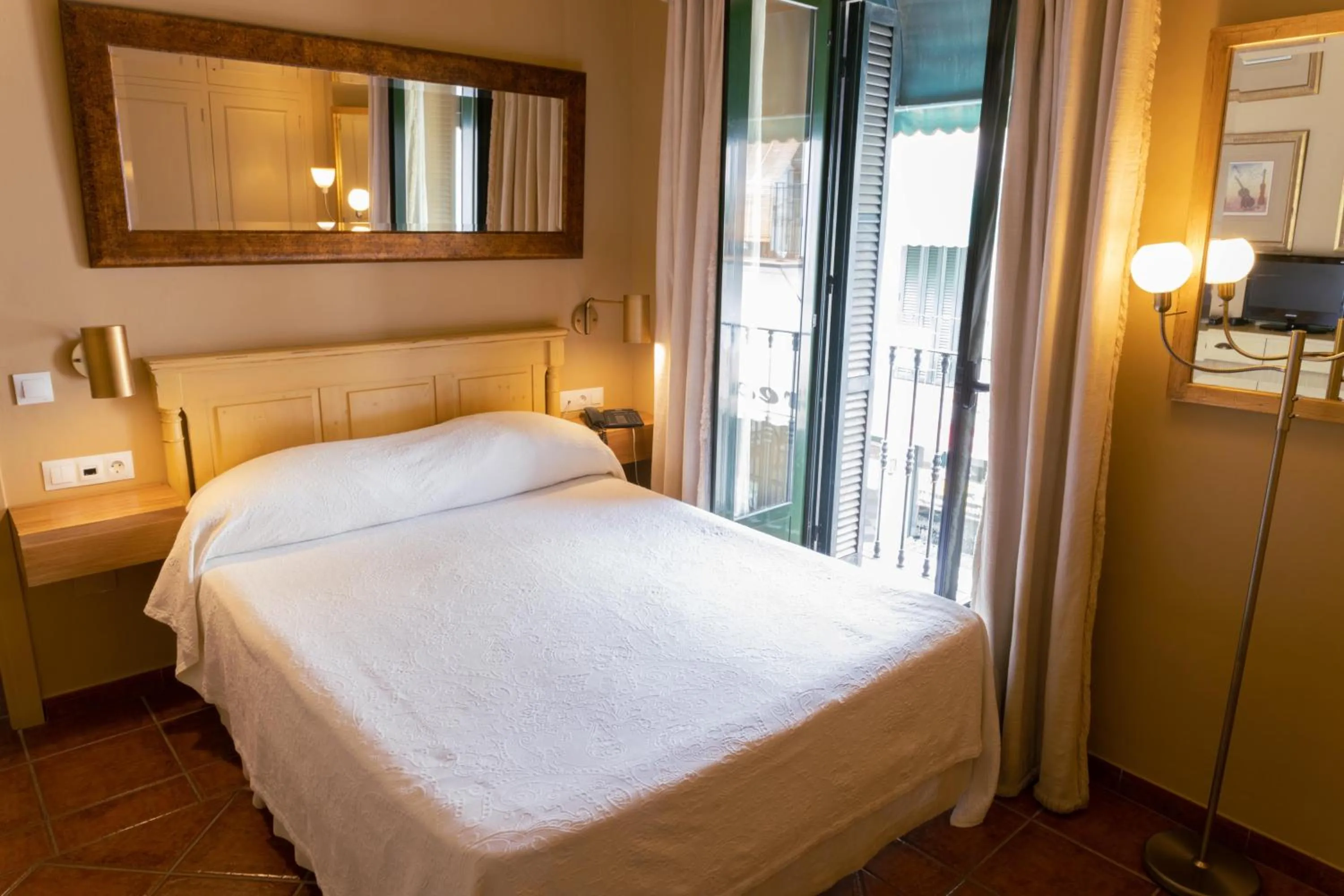 Bed in Hotel Carabeo