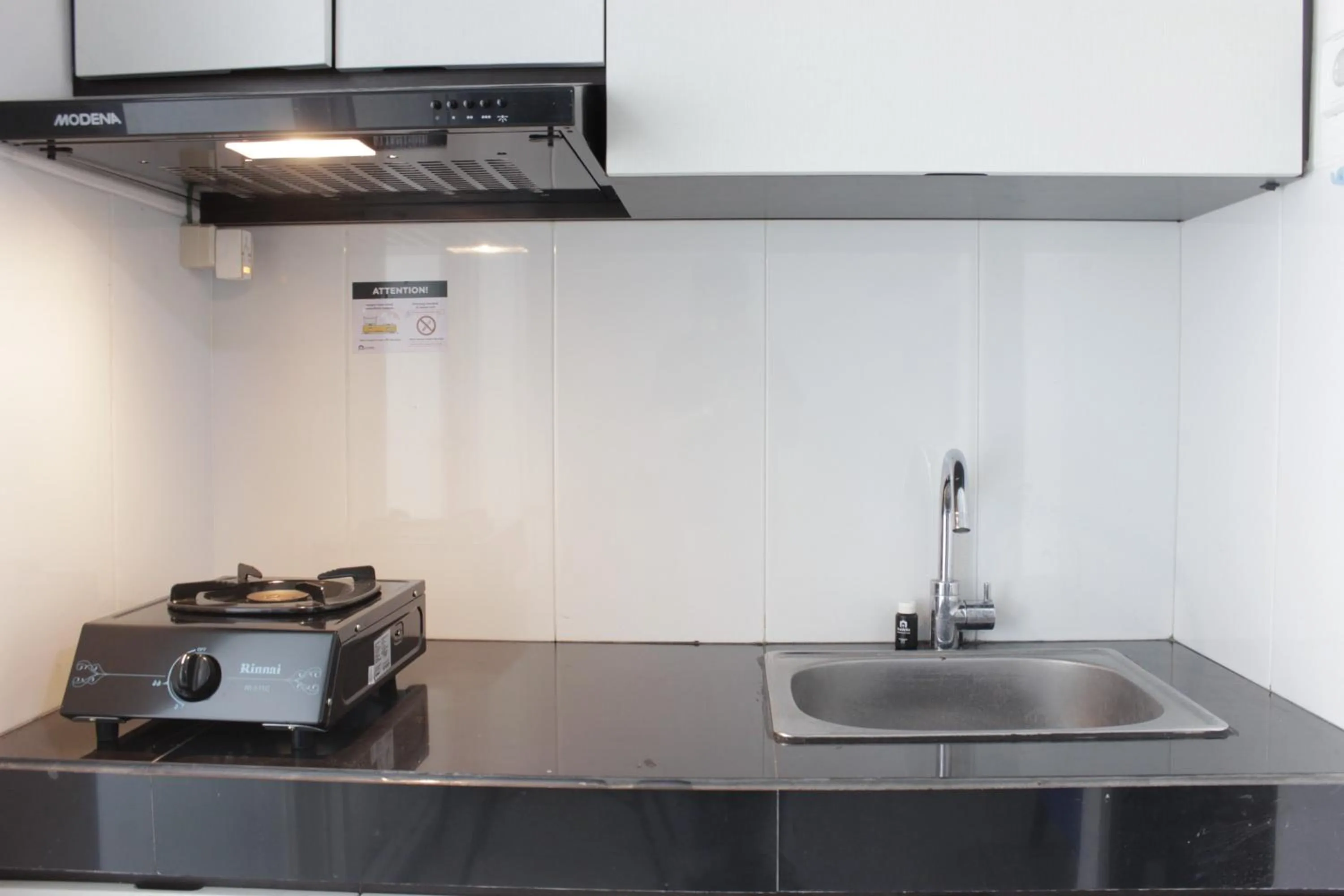 Kitchen or kitchenette in Artistic 1BR Apartment at Gateway Pasteur near Exit Toll Pasteur By Travelio