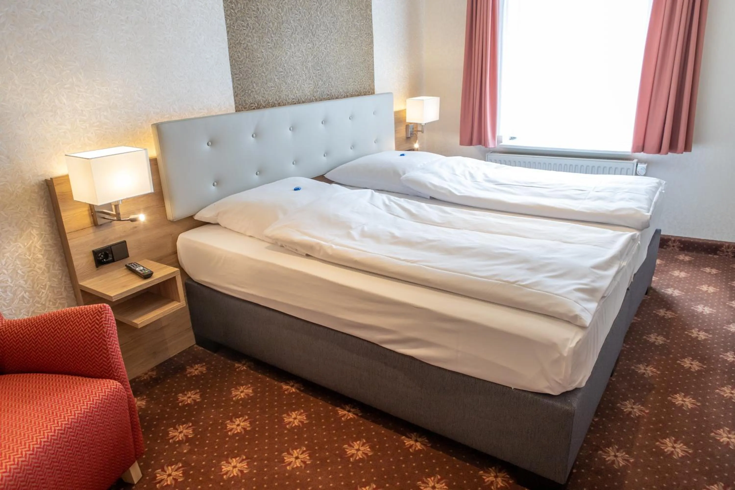 Bed in Flair Hotel Deutsches Haus