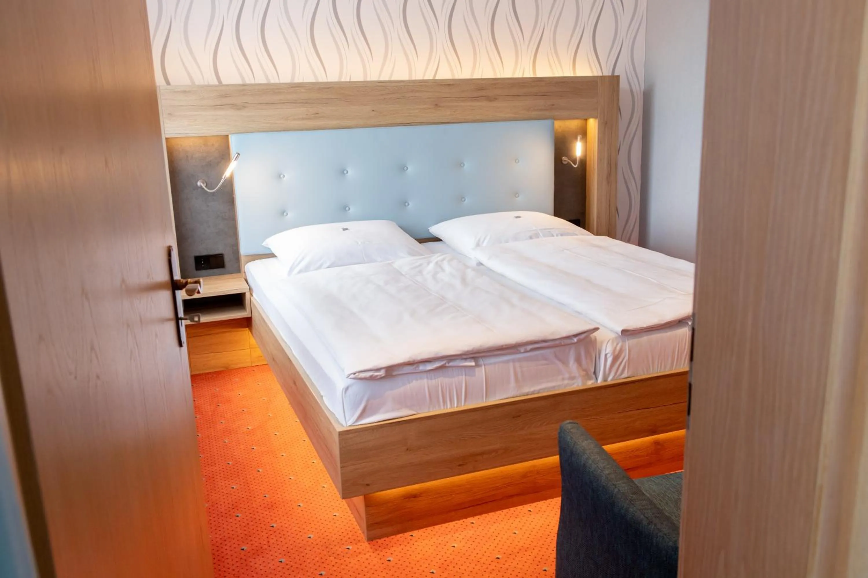 Bed in Flair Hotel Deutsches Haus