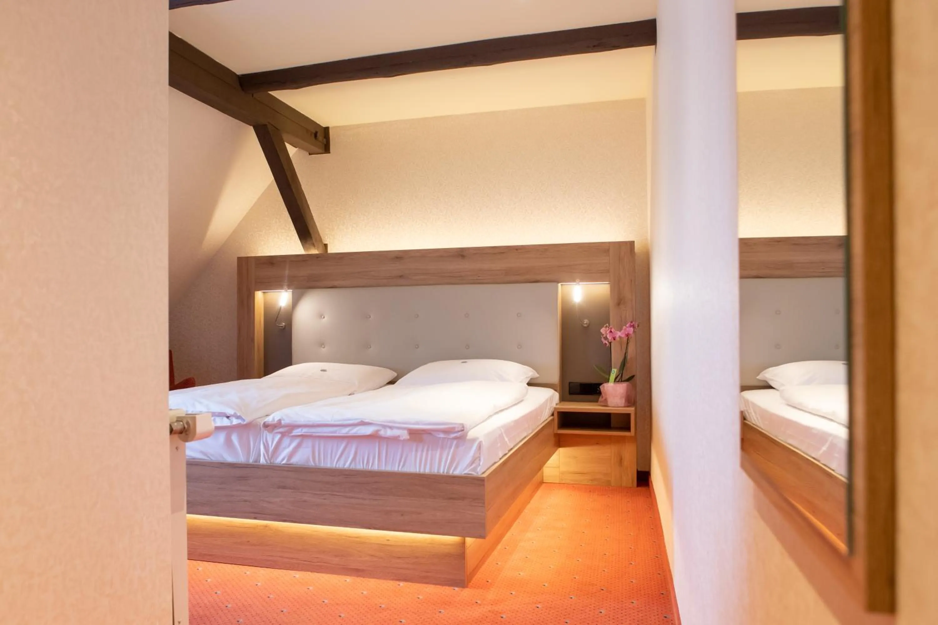 Bed in Flair Hotel Deutsches Haus