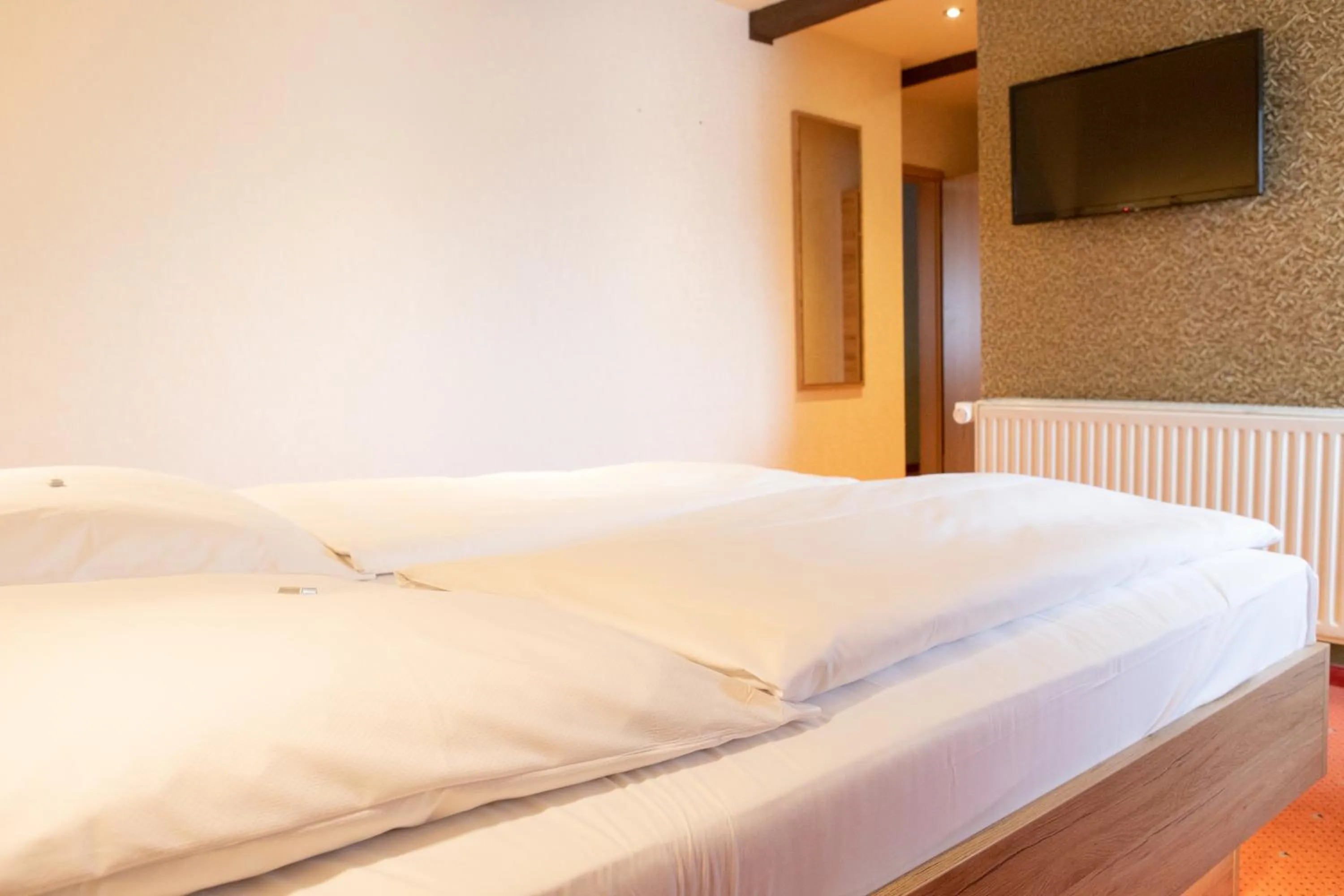 Bed in Flair Hotel Deutsches Haus