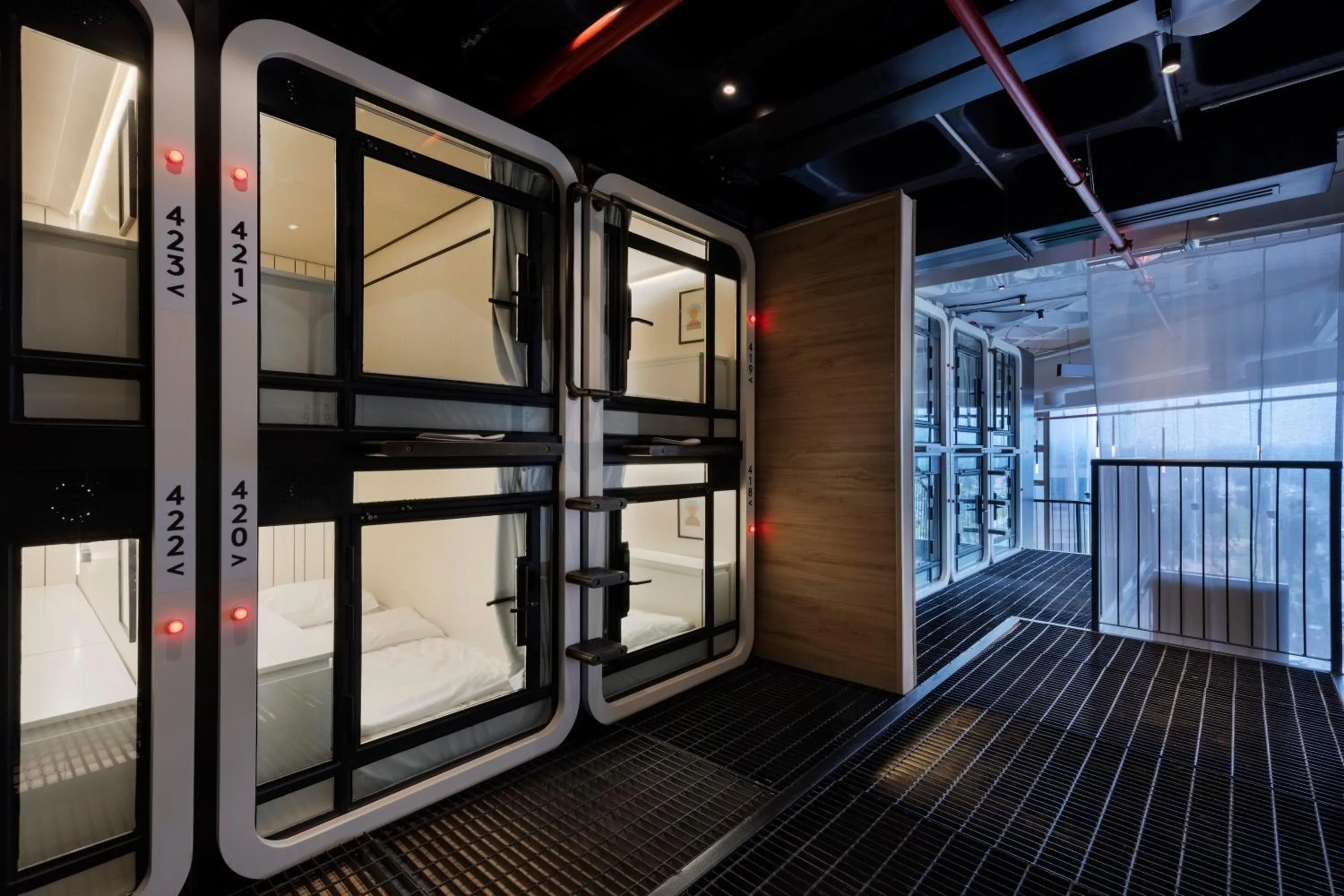 bunk bed in The O Pod Capsule Hotel