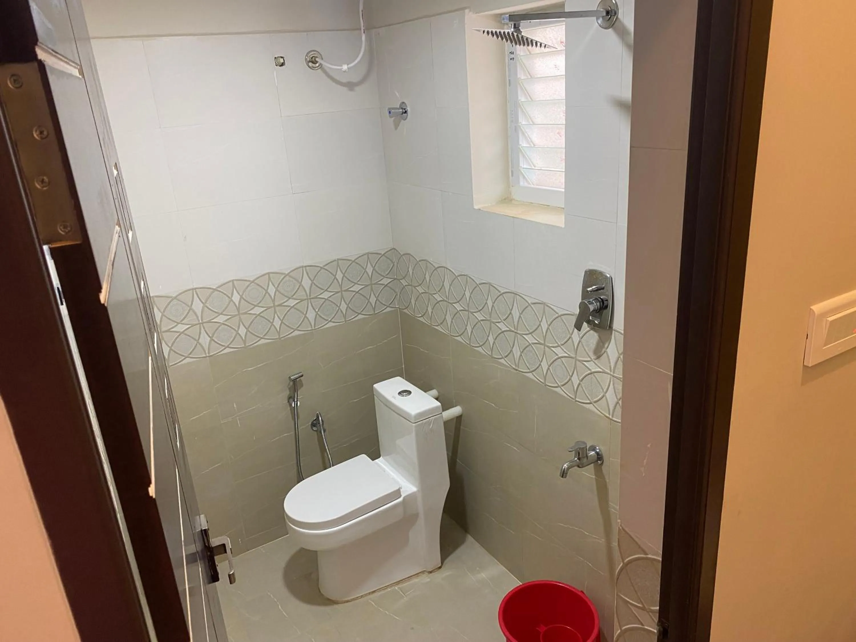 Toilet in Hotel Akshith Inn