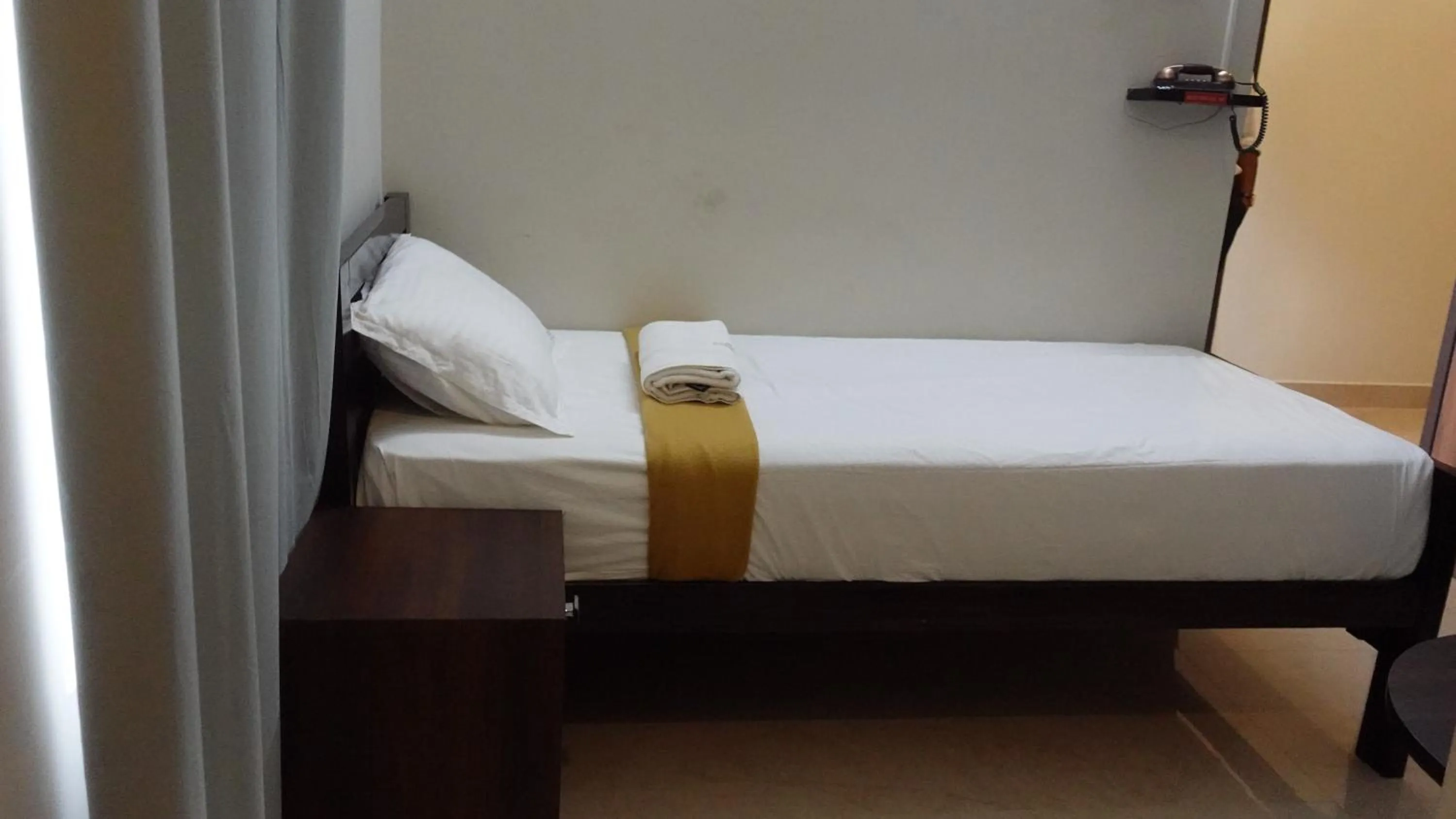 Bed in Hotel Akshith Inn